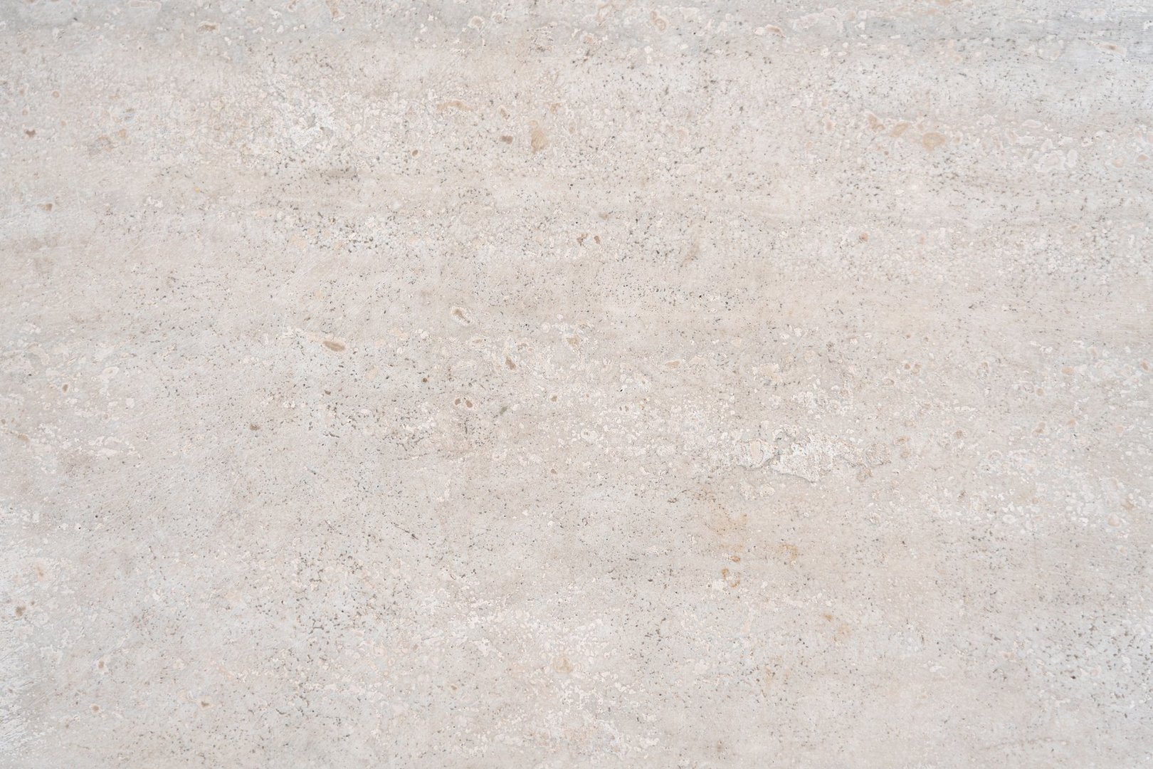 Beige limestone similar to marble natural surface for bathroom or kitchen countertop. High resolution texture and pattern.