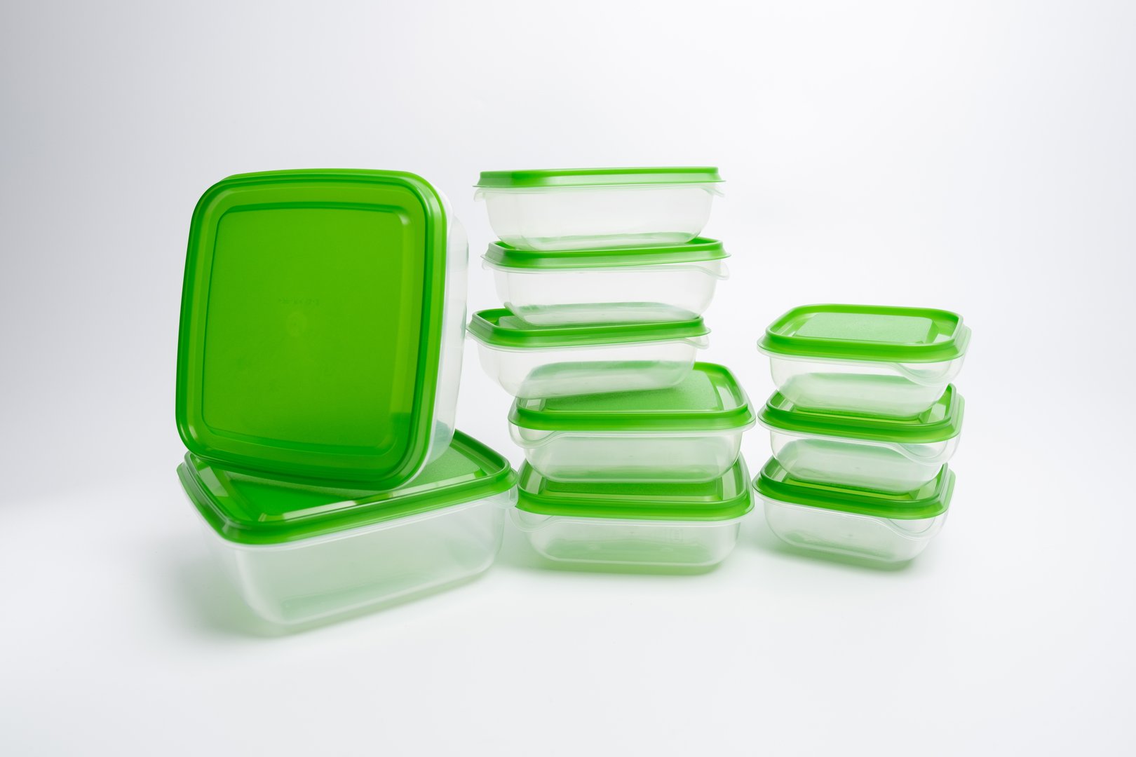 Empty plastic food containers on a light background. Organization of space. Sorting products