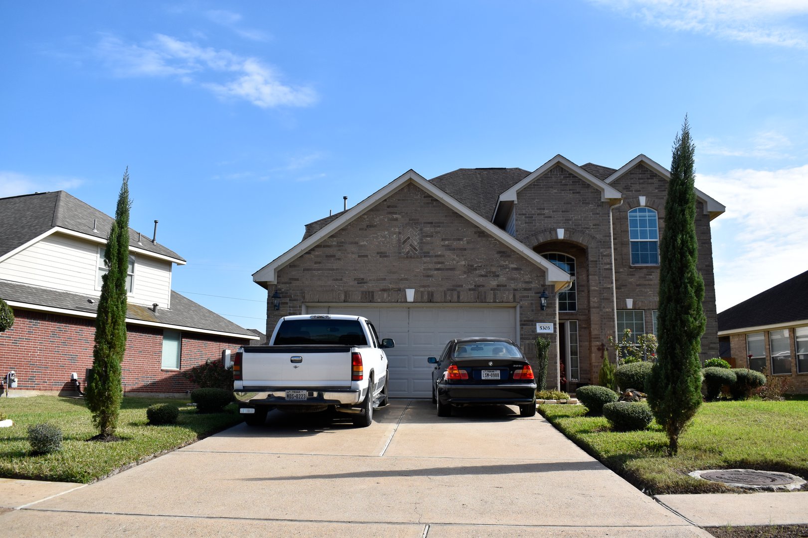 Houston, TX USA November 27, 2025 - A beautiful portrait of a retro-styled luxury home of brick in the heart of Houston Texas.