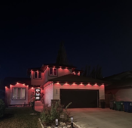 Saskatoon home with premium permanent LED lighting dressed in festive red and green