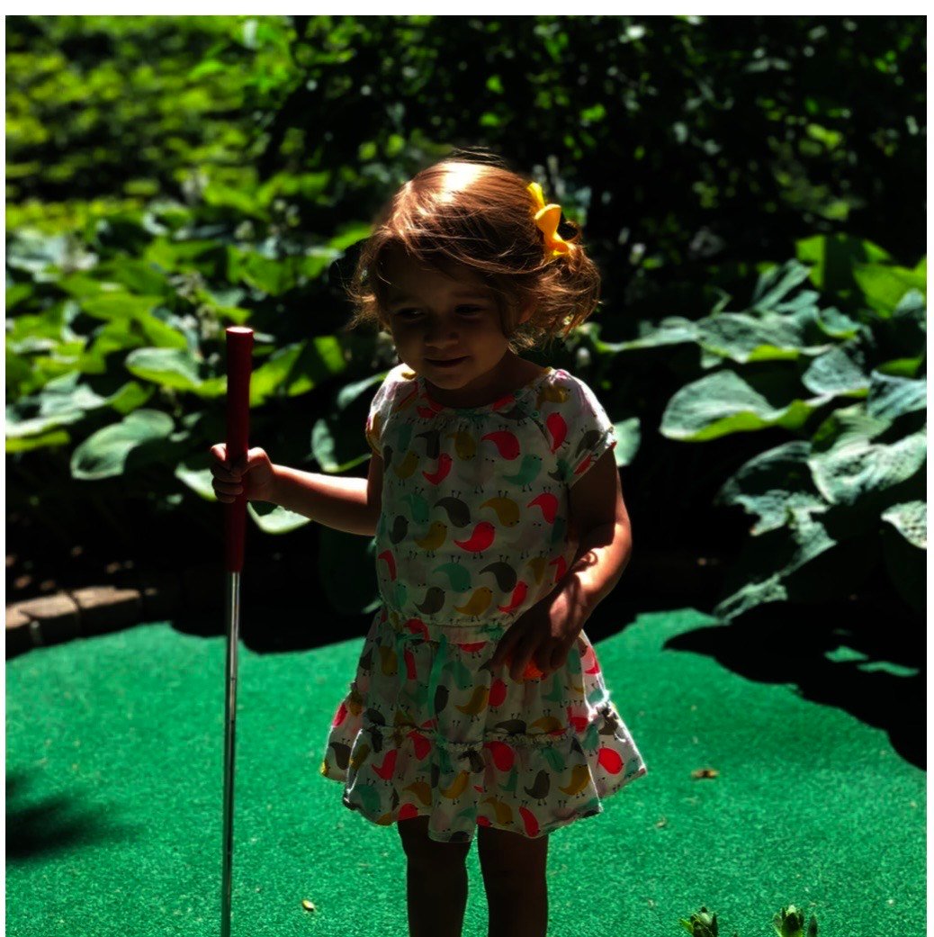 Young players enjoying mini golf at Saxon Woods with family-friendly atmosphere