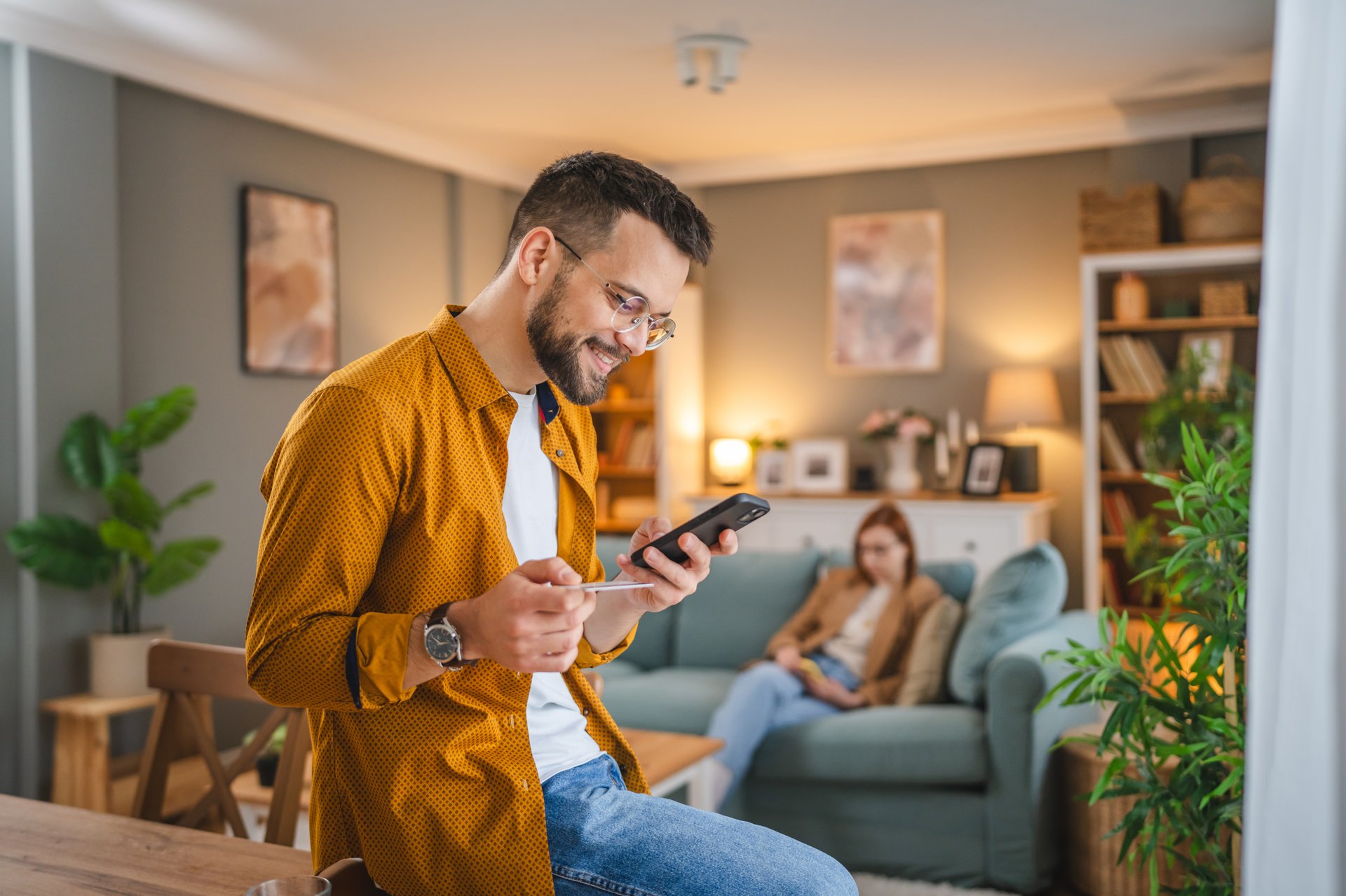 adult man at home shopping online use internet hold credit card e-banking online shop e-commerce