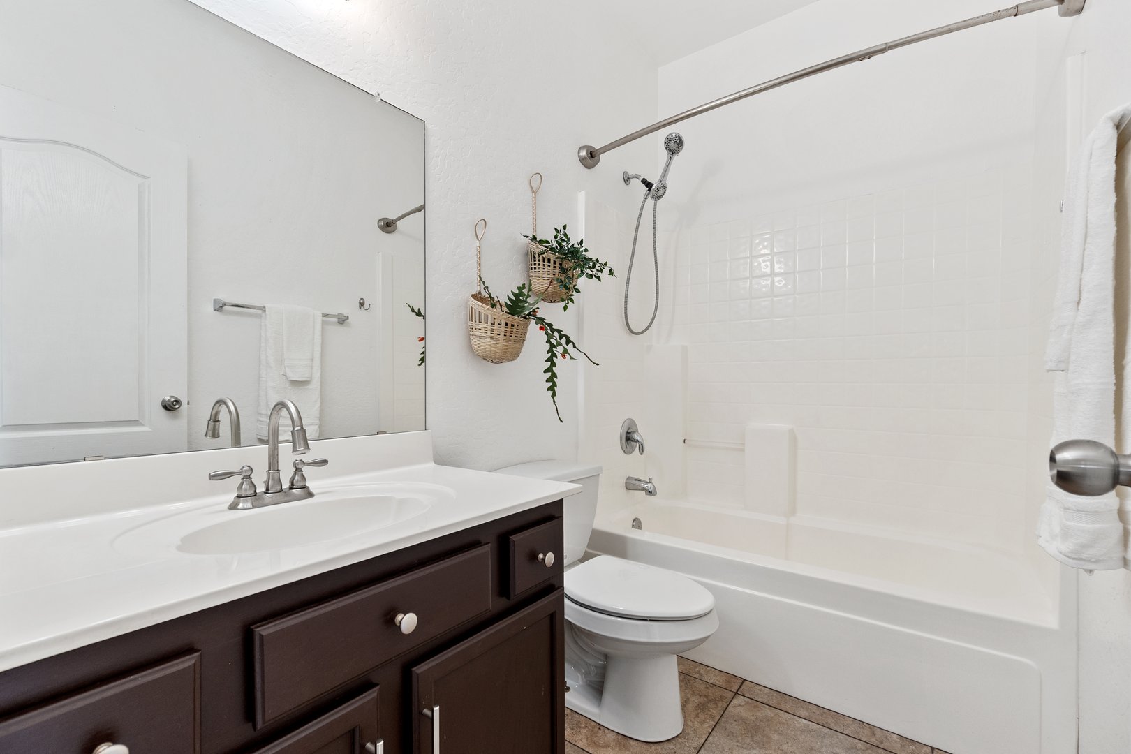 A bathroom typically includes essential features such as a sink, a toilet, a bathtub, and a mirror, all carefully designed for best use
