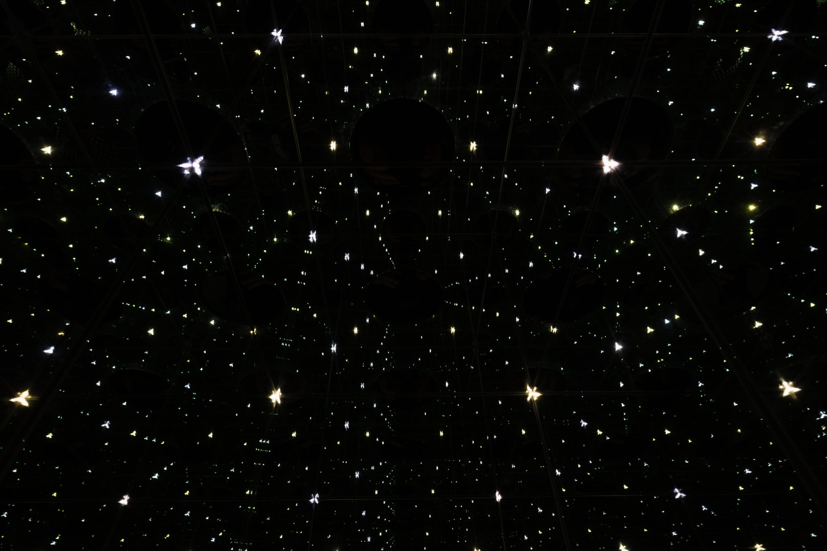 Mysterious abstract background with shimmering points of light, creating an illusion of an infinite starry space in the night sky.Close up photo