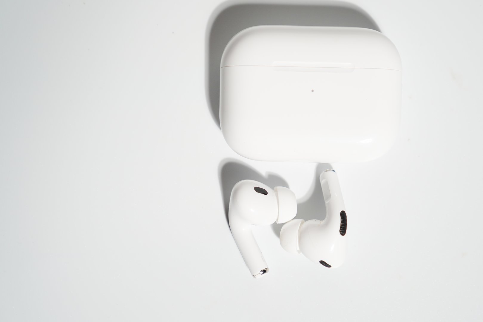 Wireless Earbuds And Charging Case On White Background