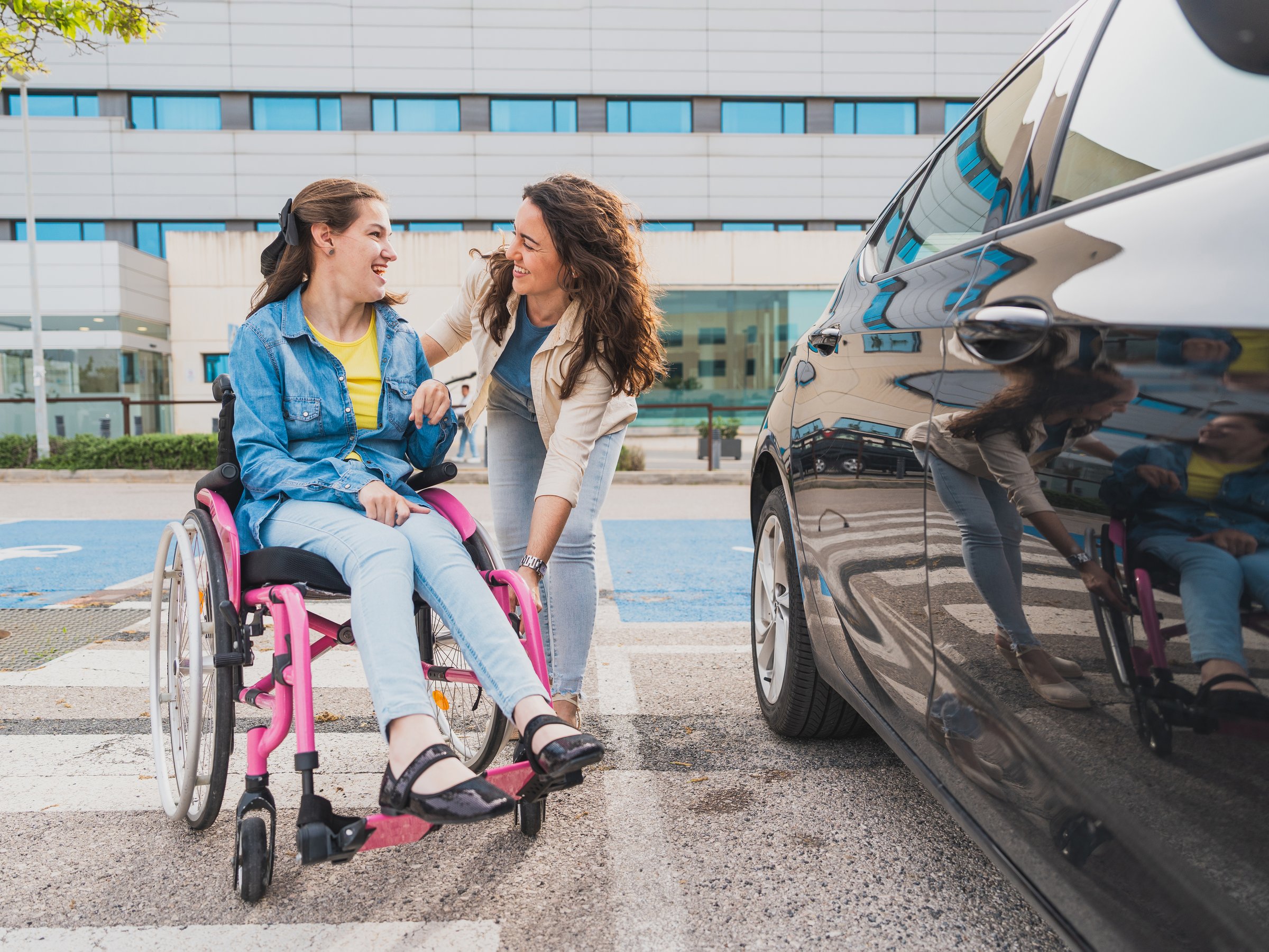 They enjoy a warm moment together after getting out of the car, concept of cerebral palsy
