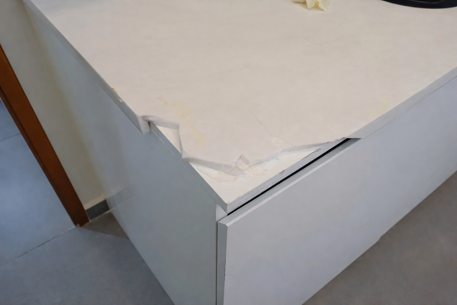 Before Corian repair - Damaged solid surface countertop with crack and damage - Best Corian crack repair near me