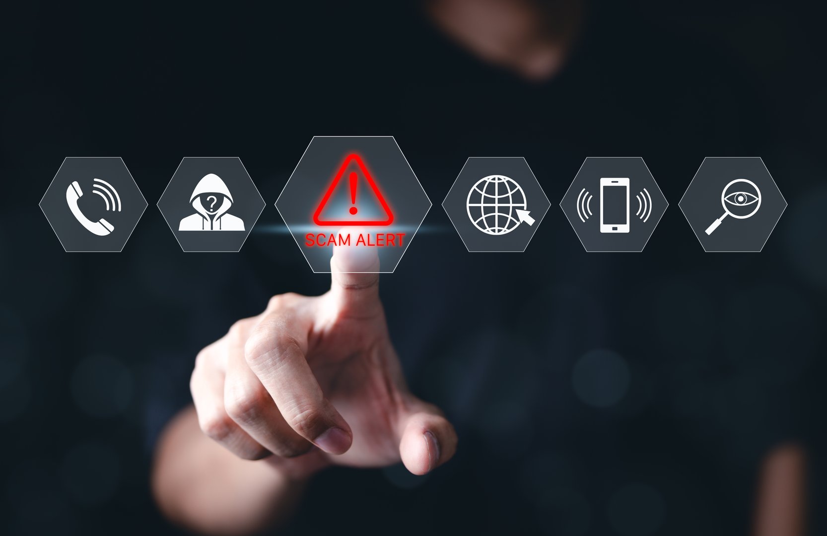 Cybersecurity scam alert warning concept. A hand interacts with a virtual interface displaying icons for scam alert, fraud detection, and online security, cybersecurity awareness and fraud prevention.