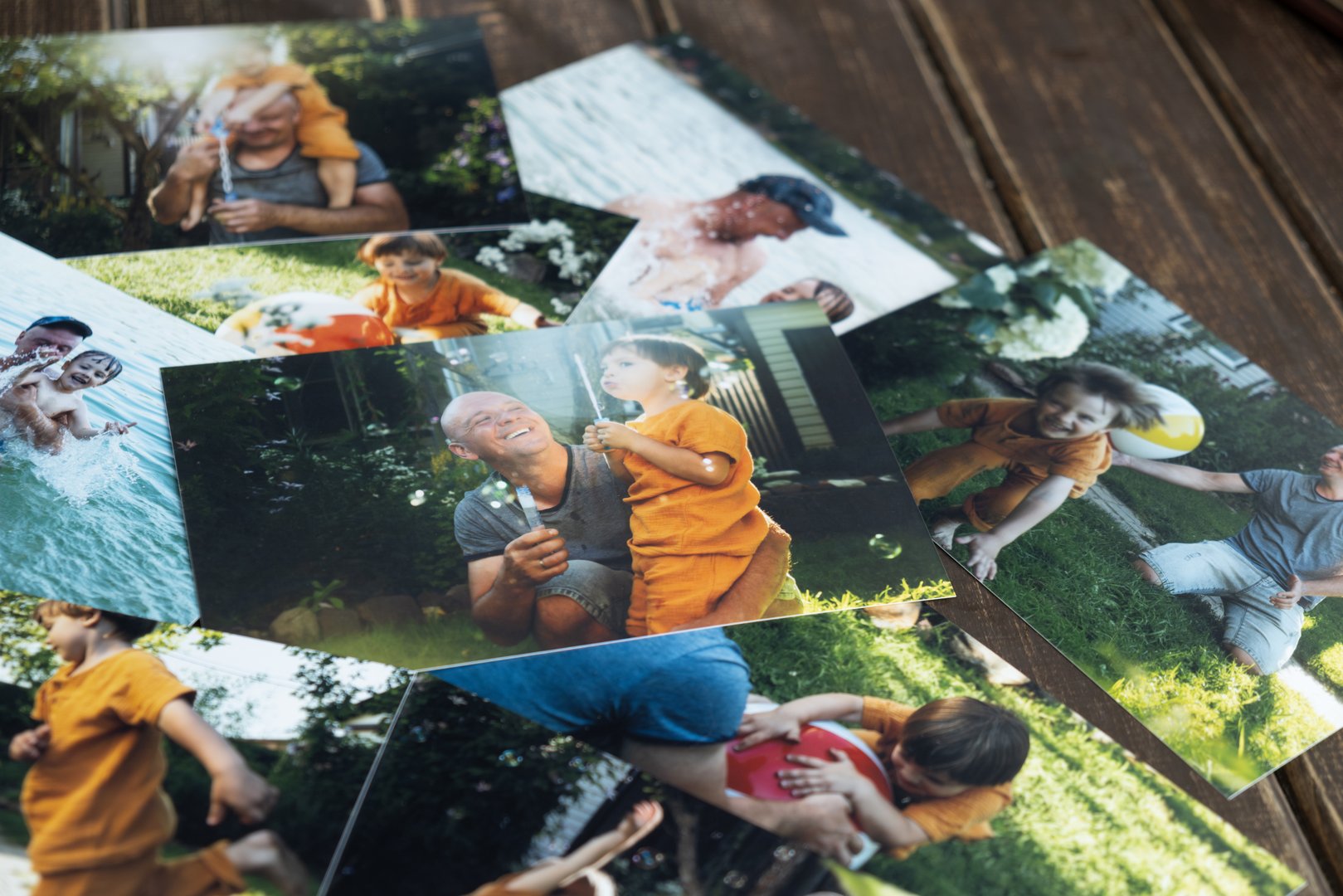 Printed family photos with happy summer moments.