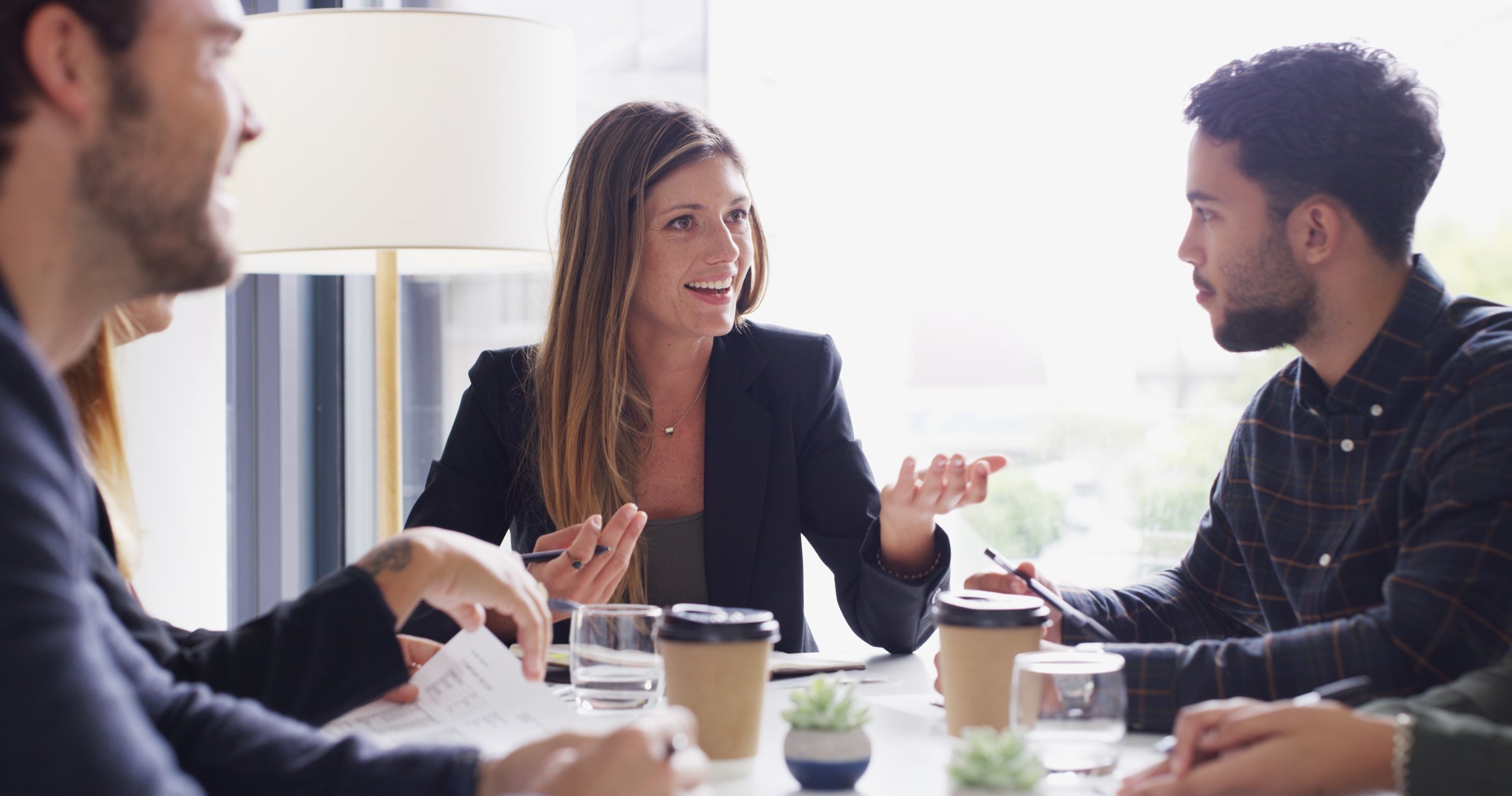 People in business meeting discussing documents