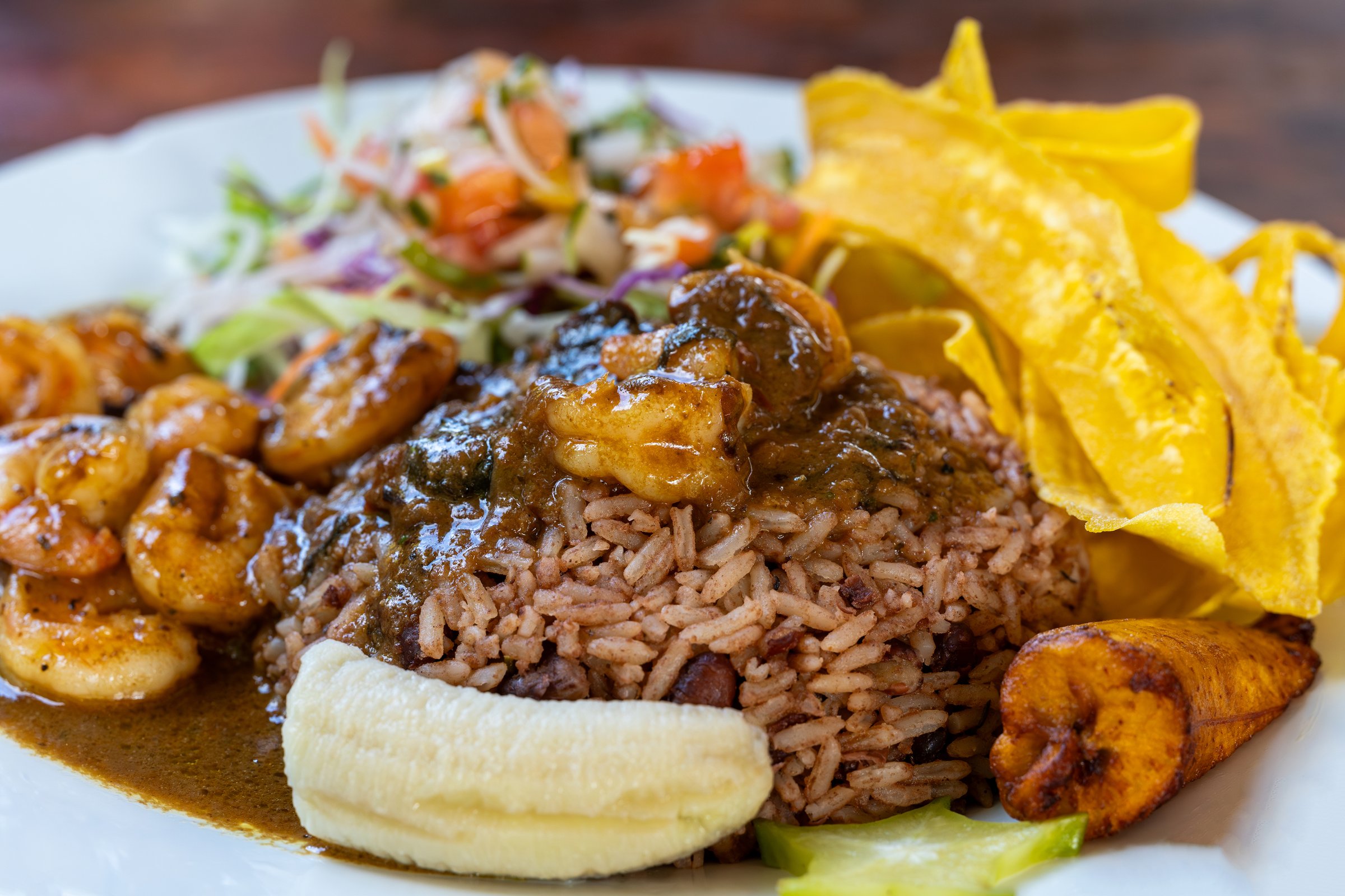 Traditional Costa Rican Caribbean dish, with rice and beans, salad, banana and shrimp
