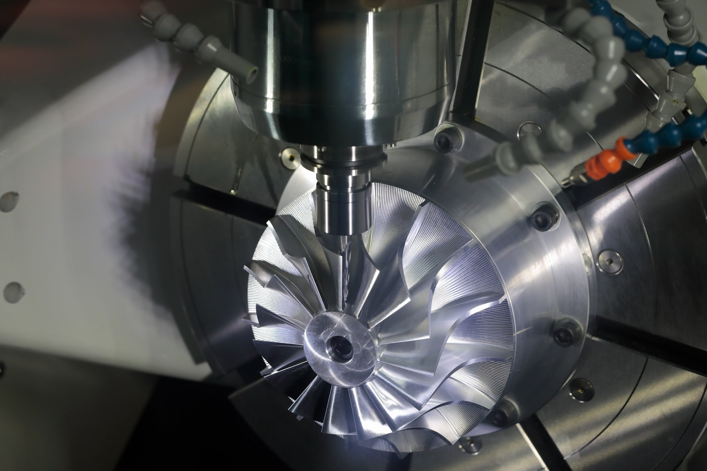 Milling process using 5-axis CNC machining center. Selective focus.