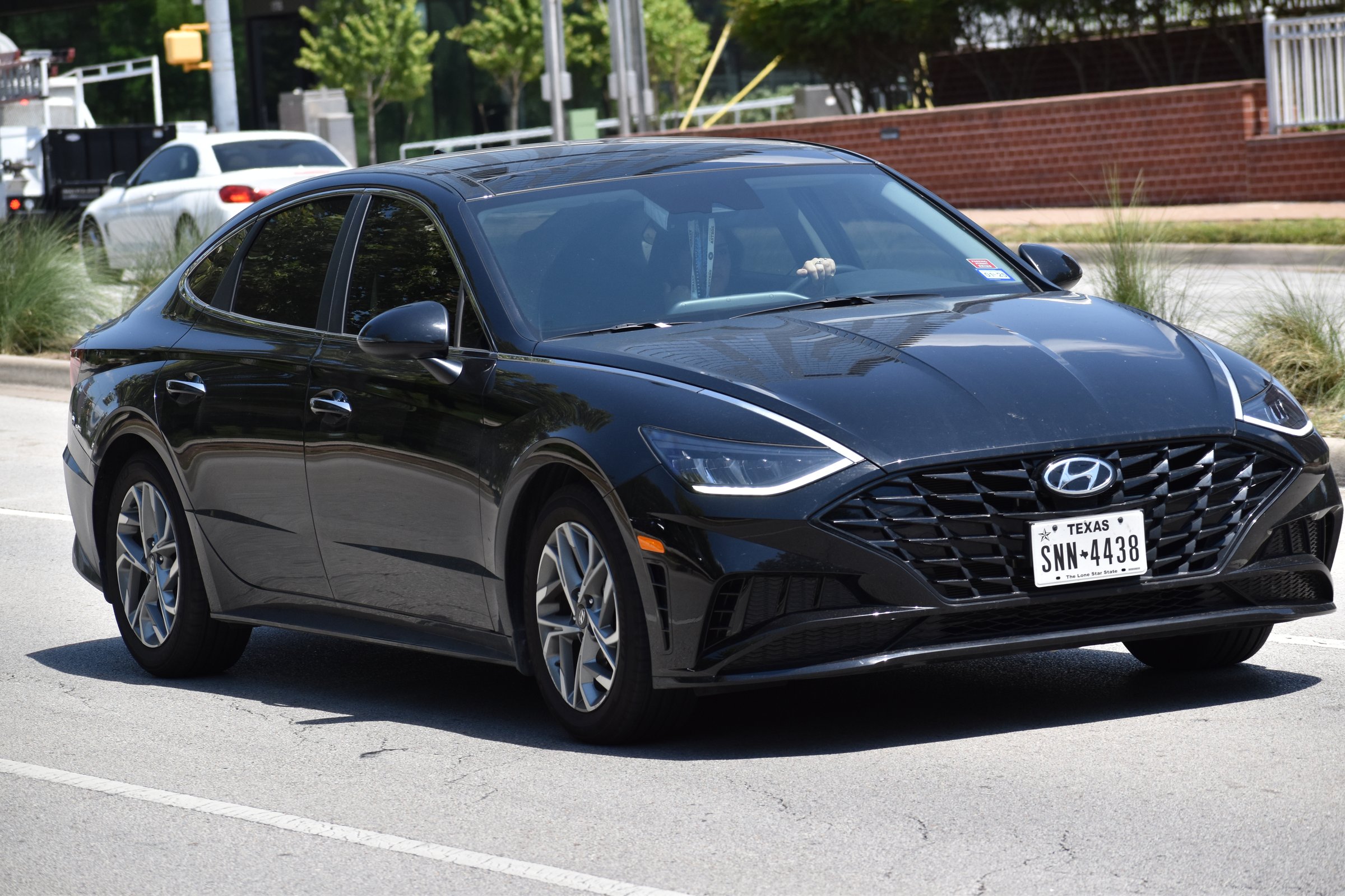 Houston, TX USA - June 28, 2023 - A A Hyundia Sonata Hybrid sedan cruising on Allen Parkway in Houston