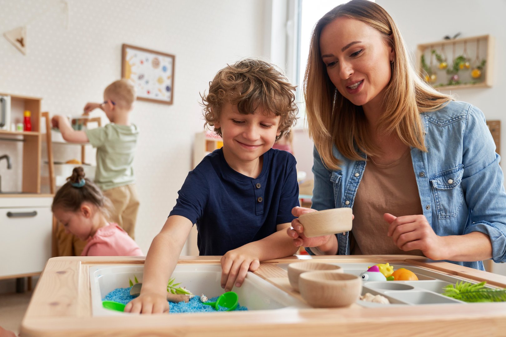 Physiotherapist doing sensory exercises with children
