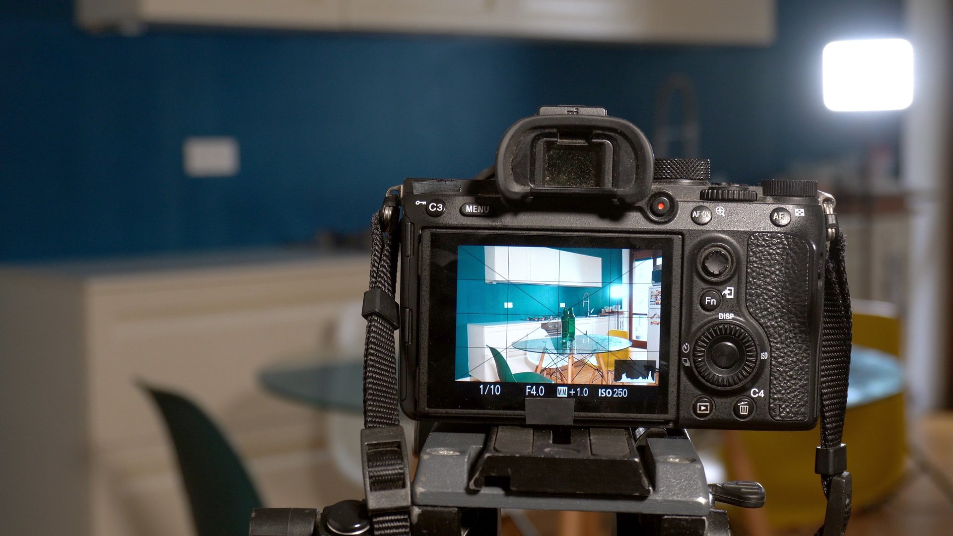 Real estate photographer takes photos and video inside house with professional camera and drone - technology to sell home - real estate agency and photograph shooting - home staging