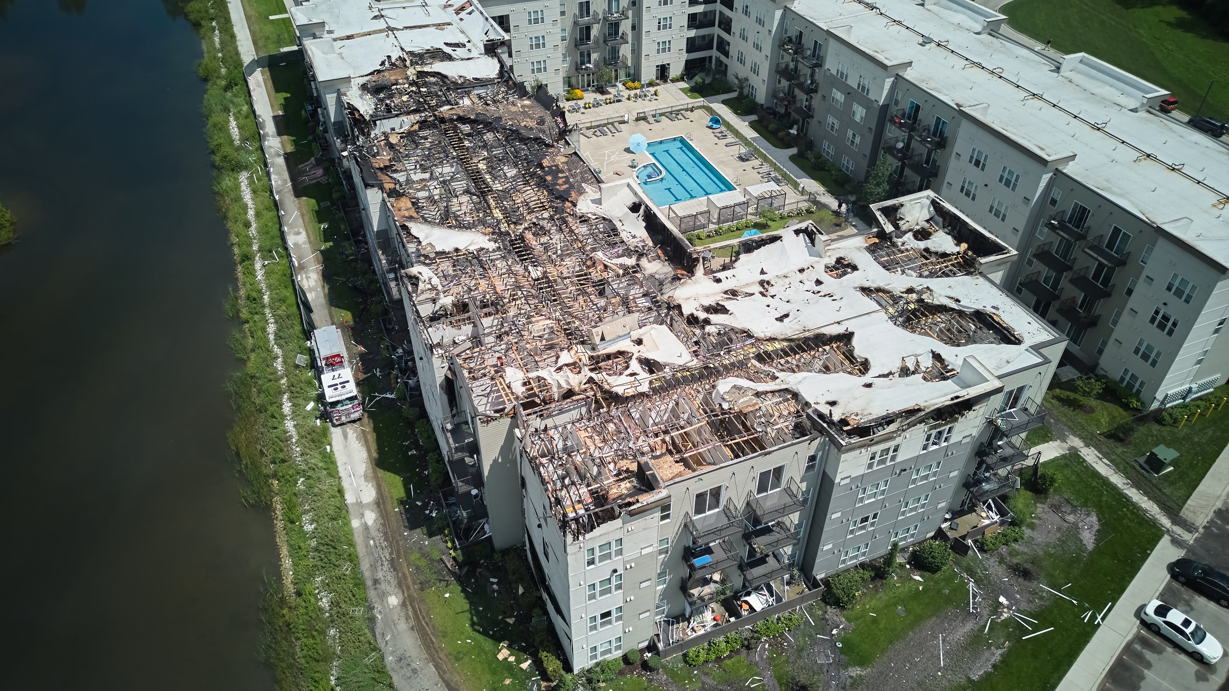 Aerial above shot of Roof of damaged apartment after burned by fire. . High quality photo
