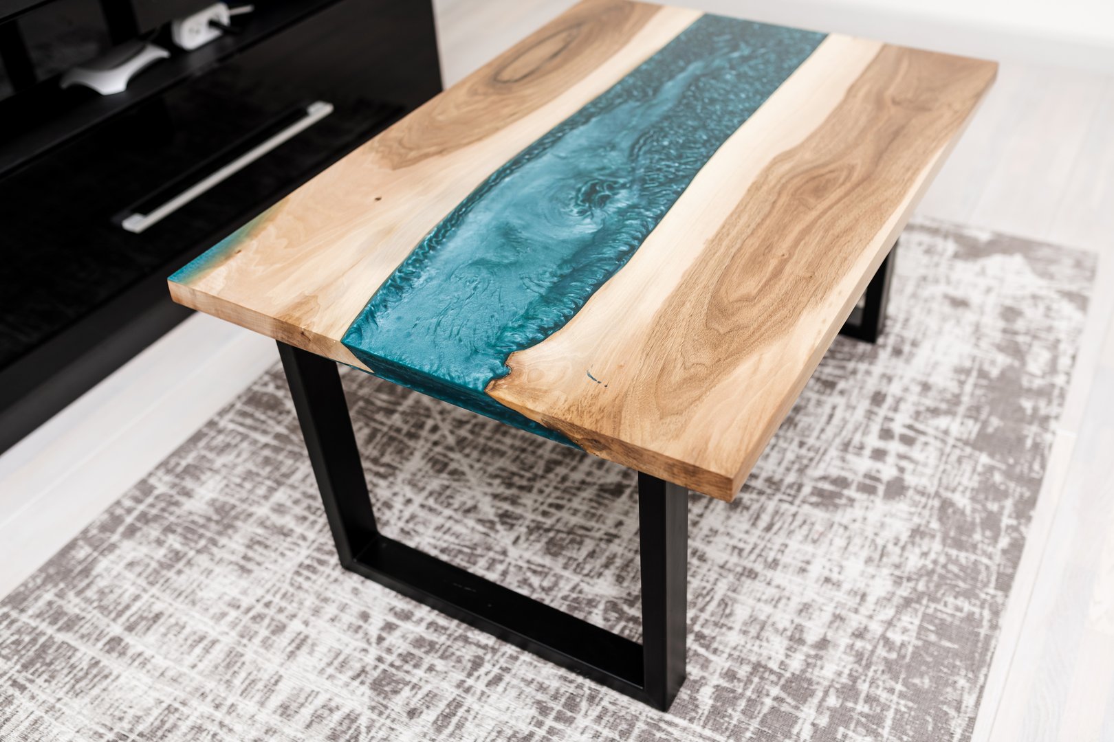 stylish and modern table made of epoxy resin and wood in the interior