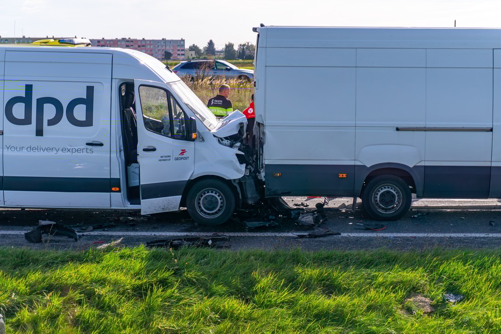 Skalmierzyce, Greater Poland Voivodeship, Poland - september 26, 2025 The image shows a pile-up scene where a DPD van collided with another van, with significant front-end damage and vehicle debris scattered on the road.