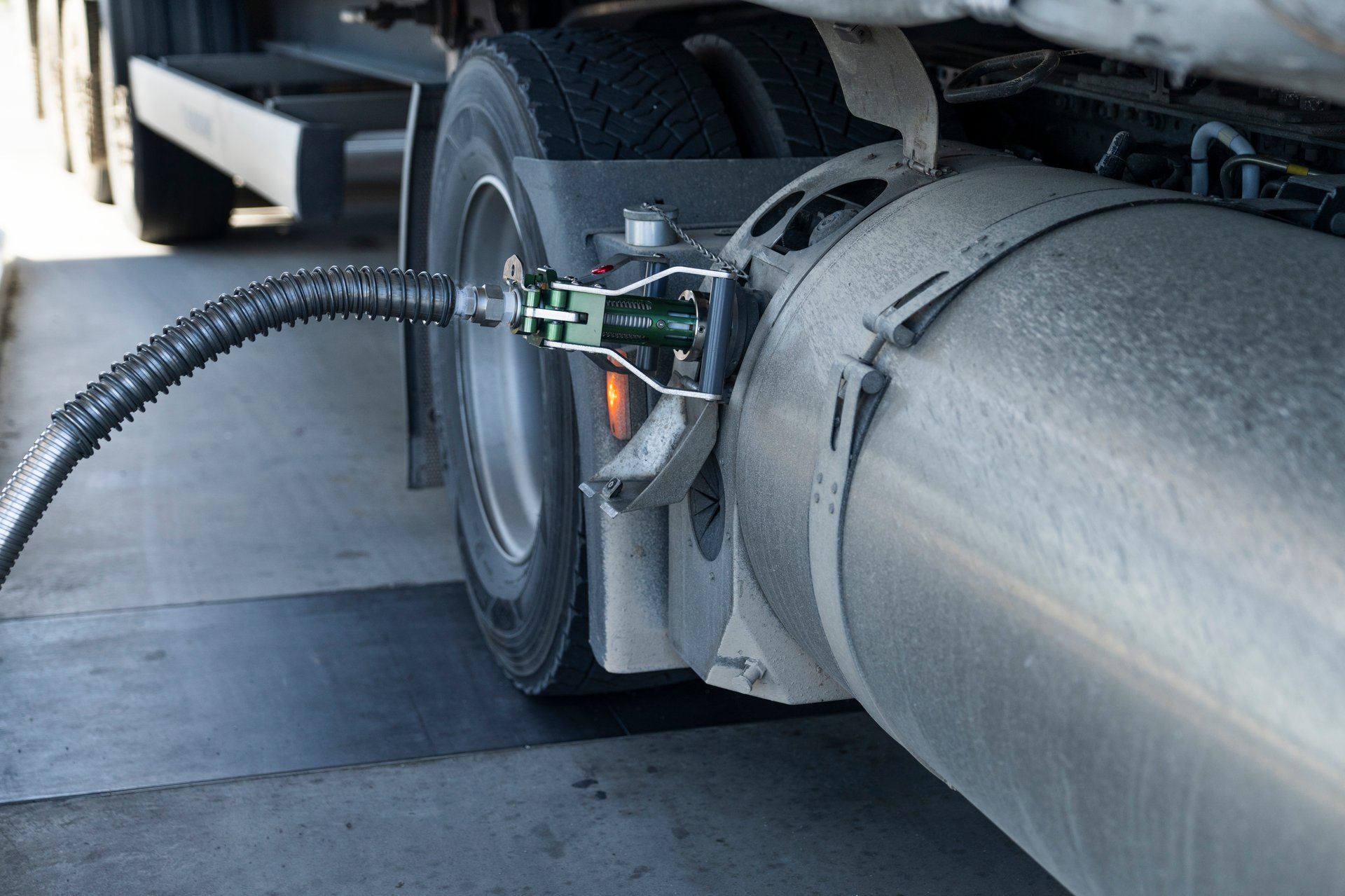 Semi truck refueling with tank for liquid natural gas (LNG).