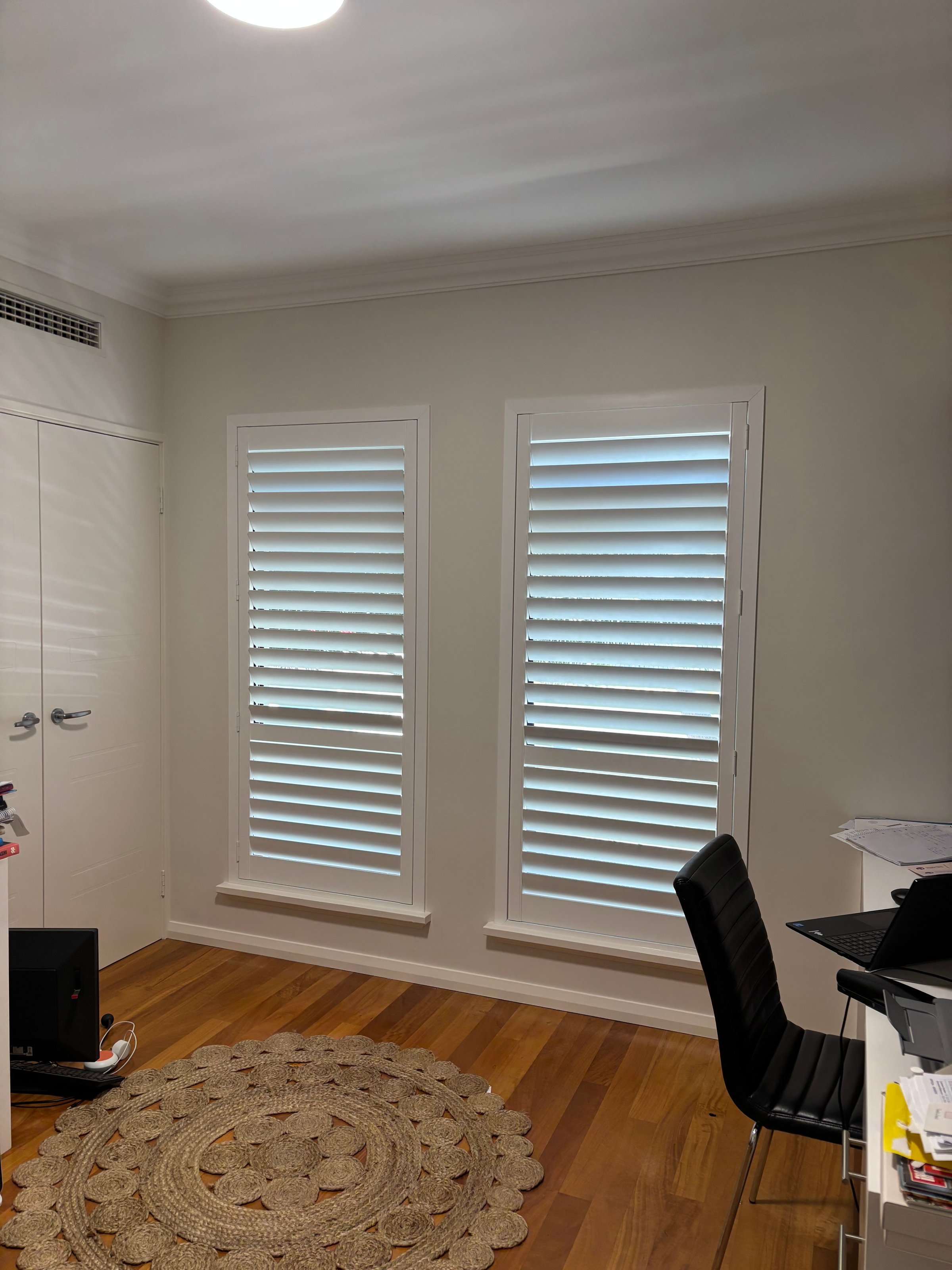 Custom plantation shutters Perth installation in elegant home interior