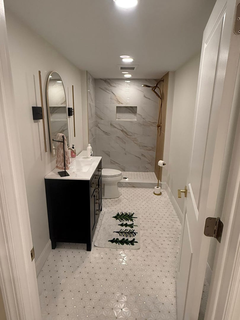Custom basement bathroom with tile shower installation