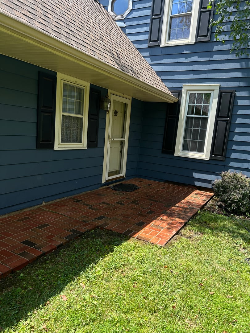 High-pressure cleaning service restoring outdoor surfaces and patios