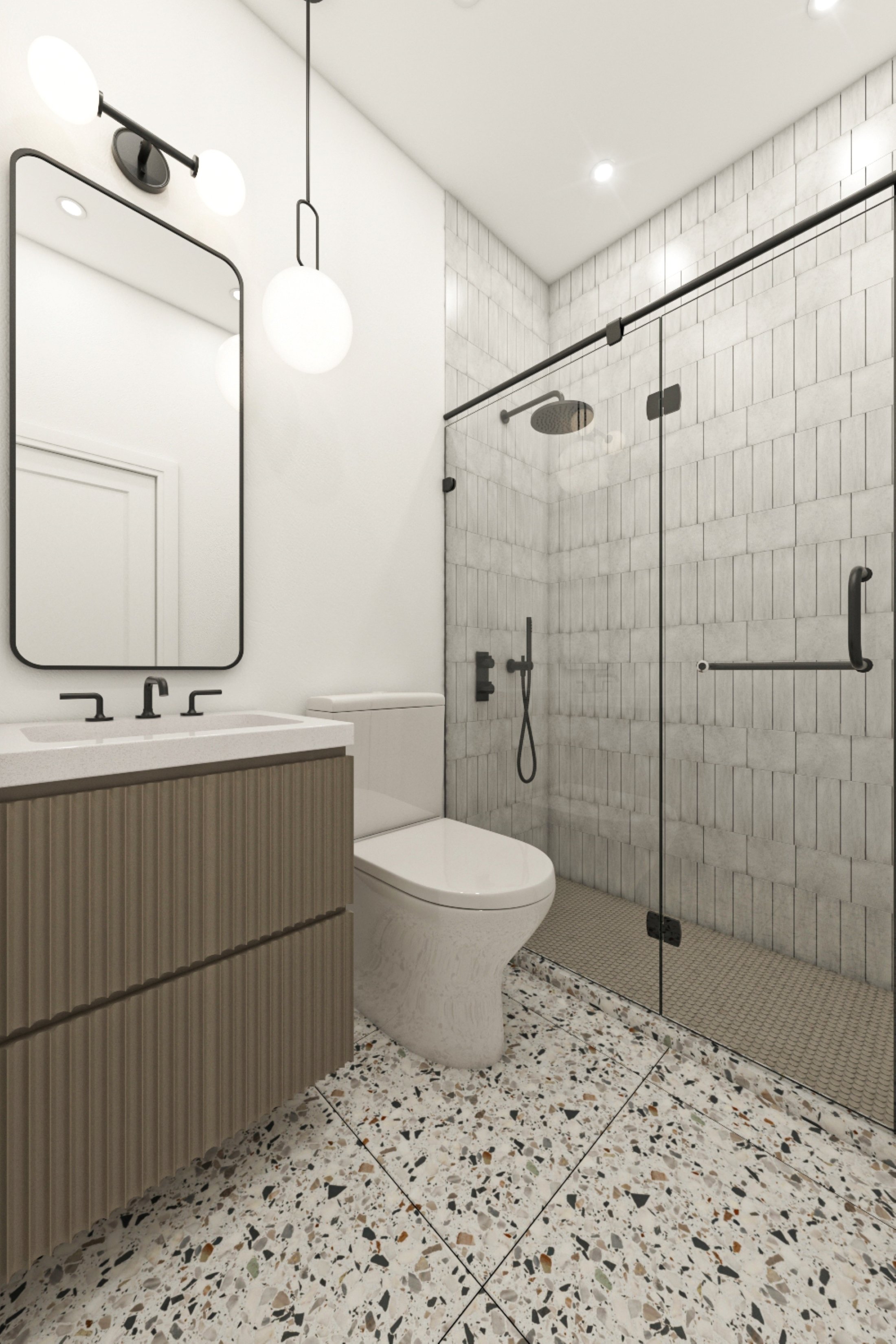 Bright and modern bathroom interior featuring a glass shower, stylish vanity, and terrazzo flooring. Sleek lighting adds a contemporary touch to this clean and functional space.