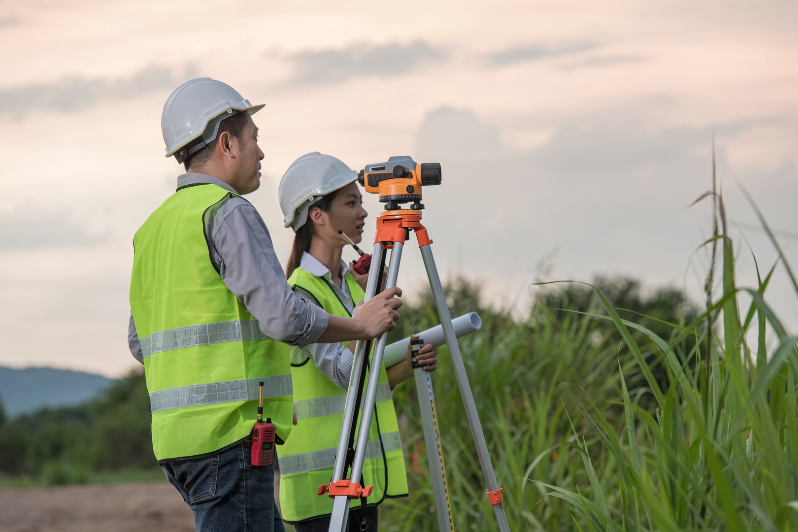 Male and female work on site construction
