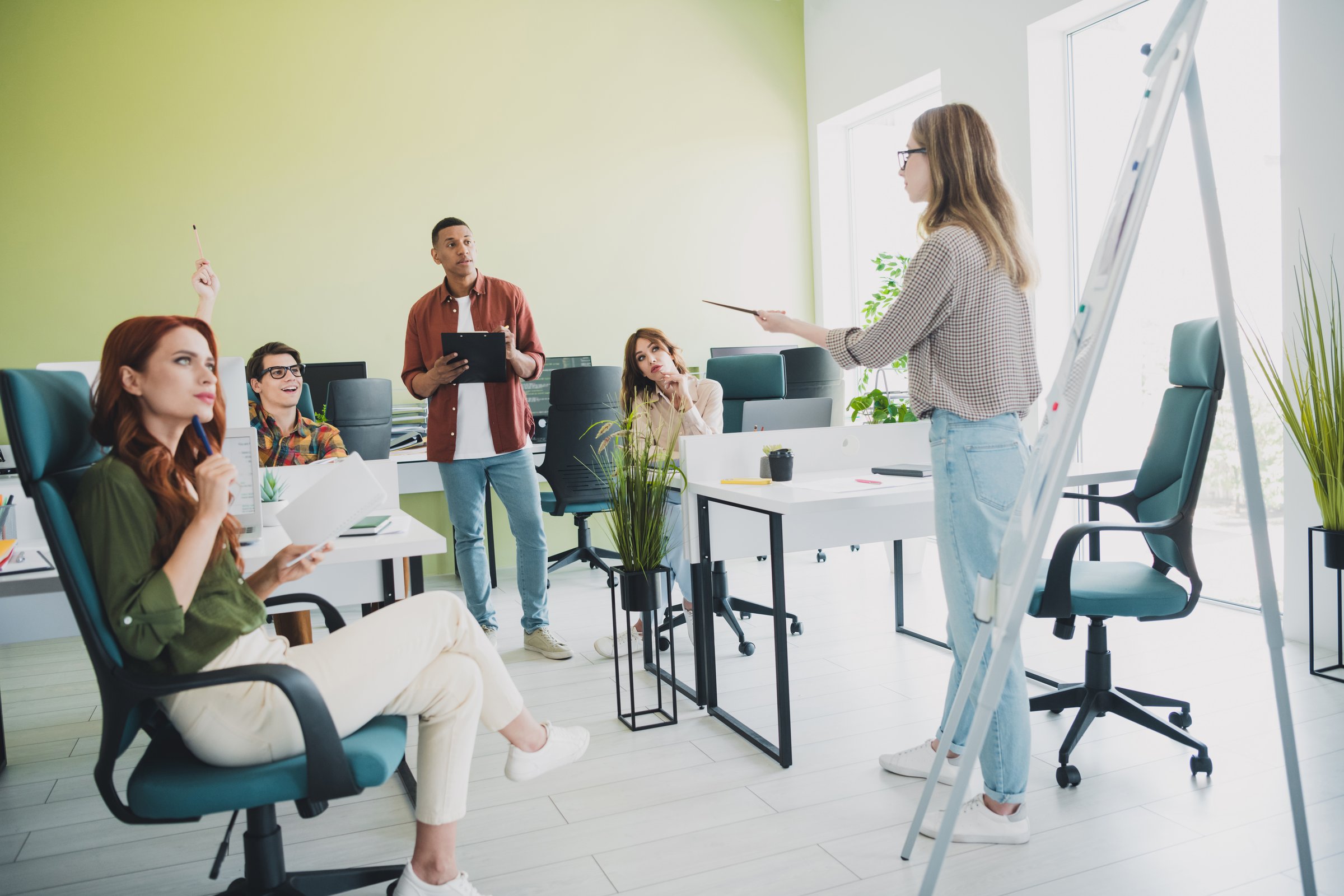 Photo of smart cheerful young it coworkers enjoying professional education together listening lecture indoors workplace workshop.