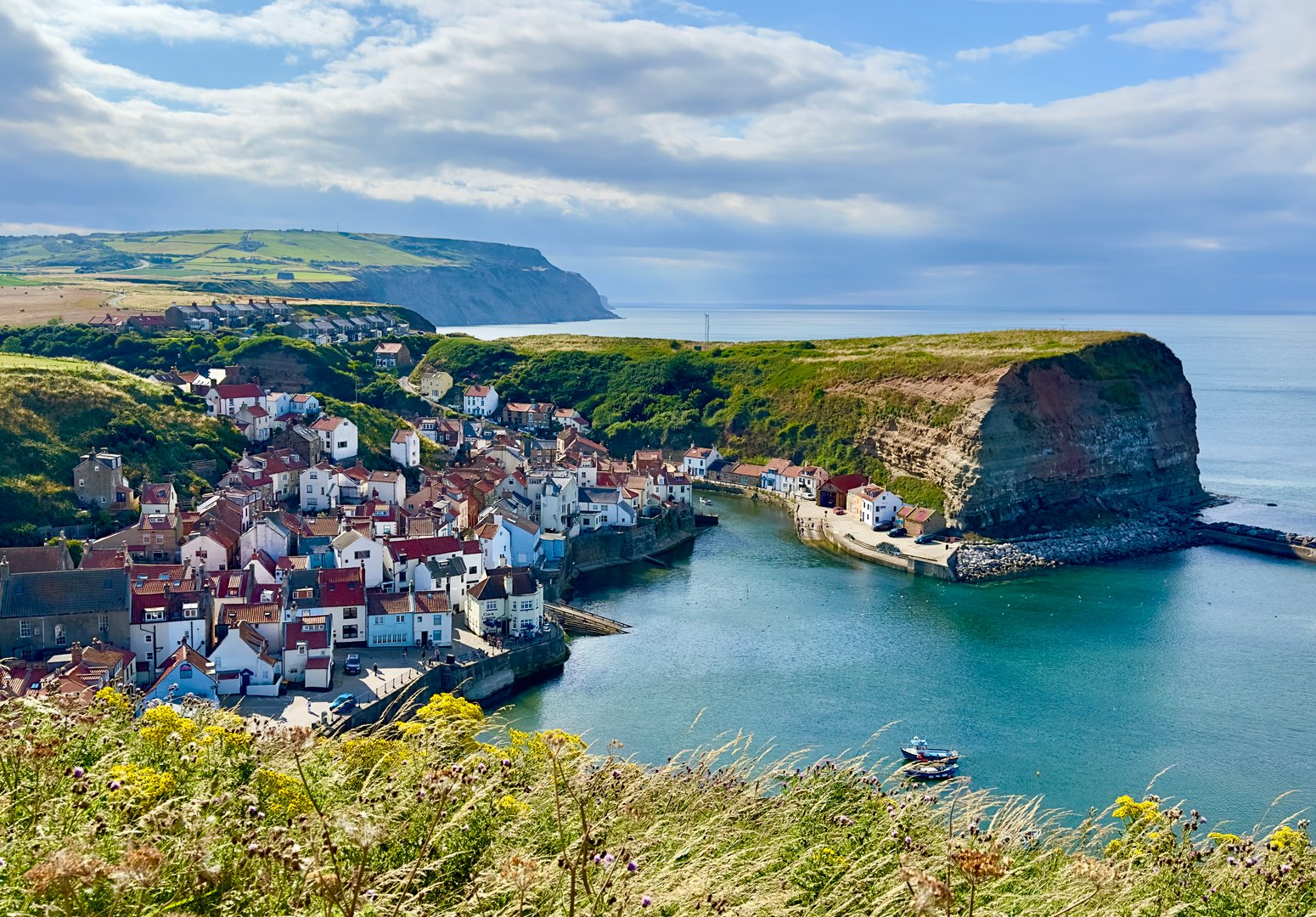A high angle view of the harbourfront village of Staithes in North Yorkshire, UK.