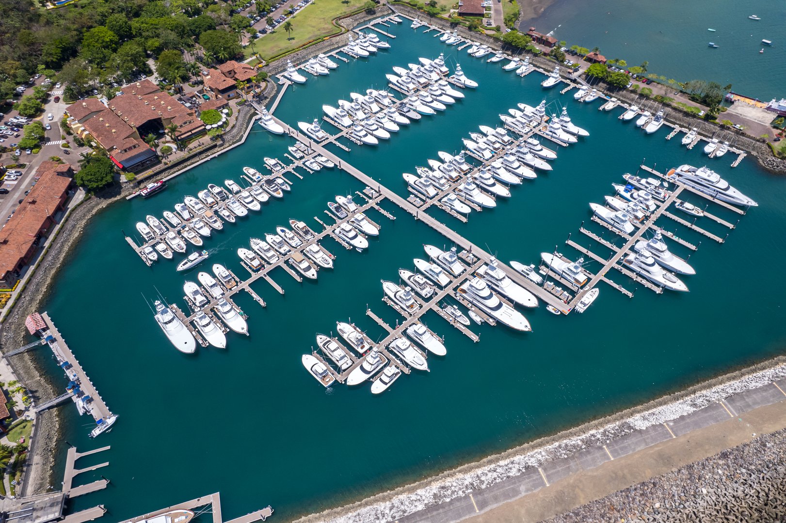 Beautiful aerial view of the Los Sueños Marina in Herradura Beach in Costa Rica. Yachts in the dock, luxury residential housing and real state