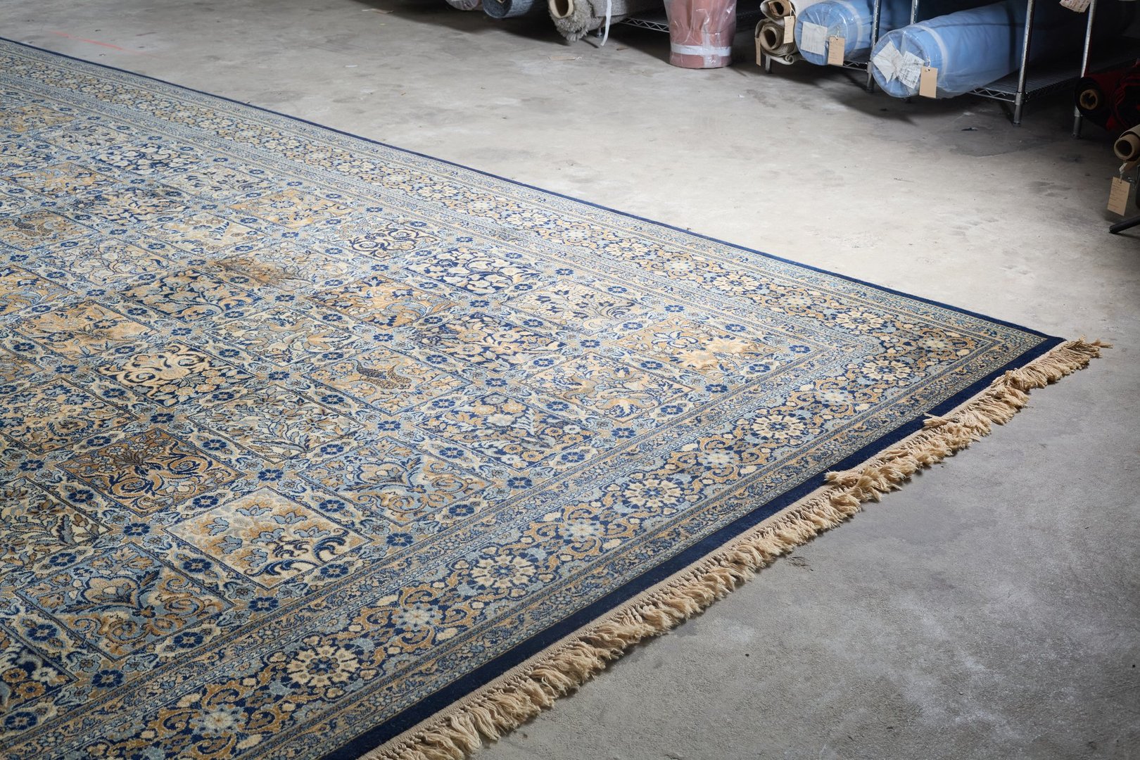 Large heavy vintage area rug with furniture requiring professional pickup and cleaning services in Atlanta