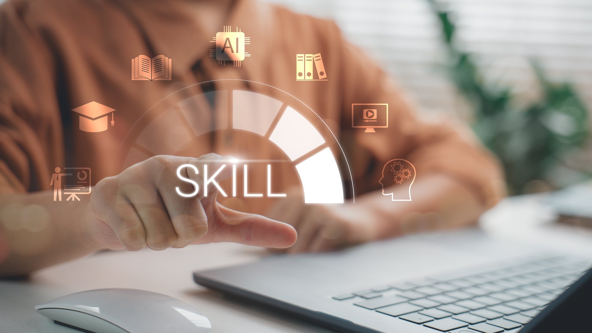 Hand pointing at virtual skill development icon on laptop screen, symbolizing online learning, digital training, reskilling, upskilling, education technology, and professional career growth.