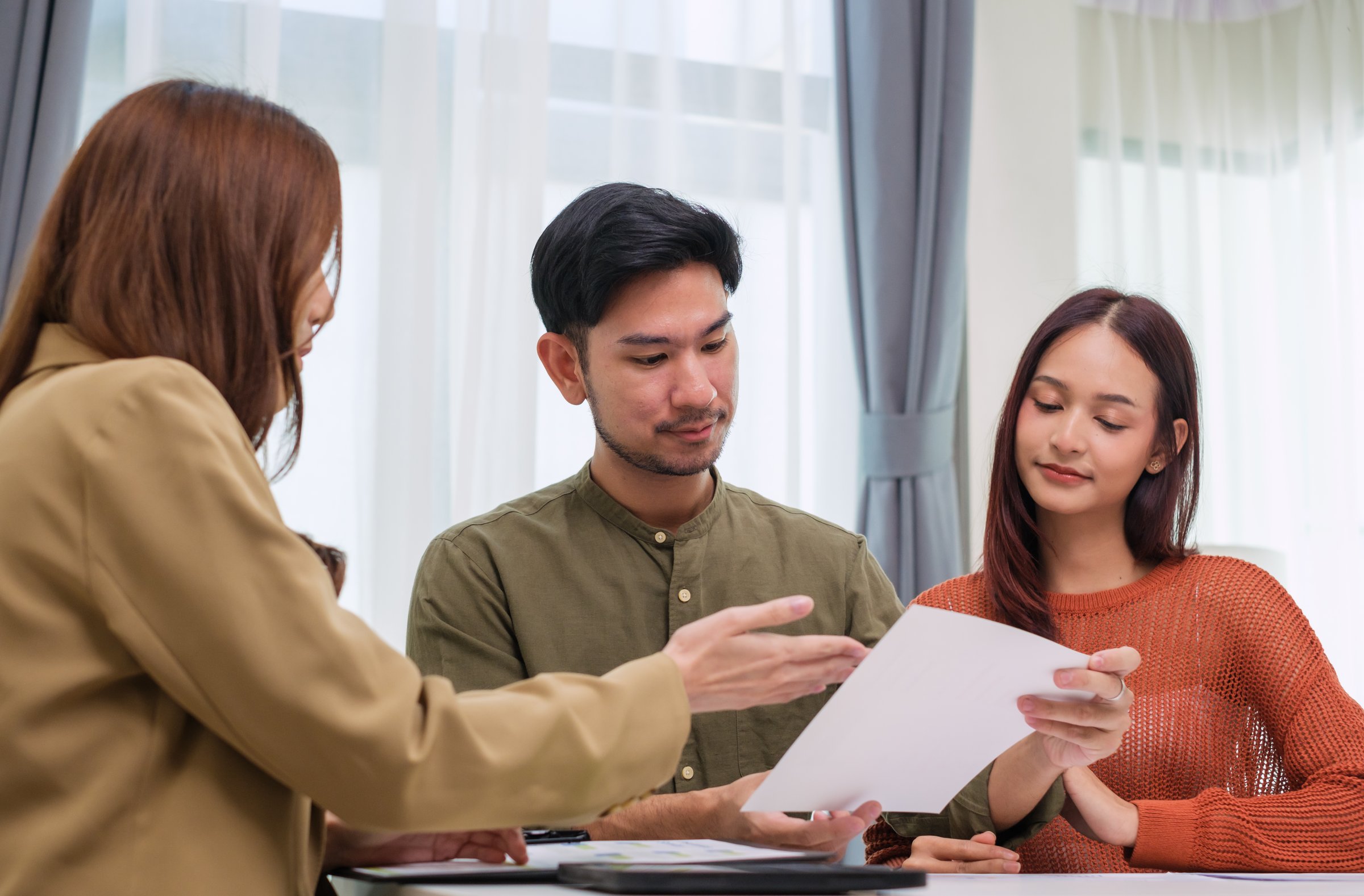 Nevada mortgage advisor helping couple compare FHA vs conventional loan options