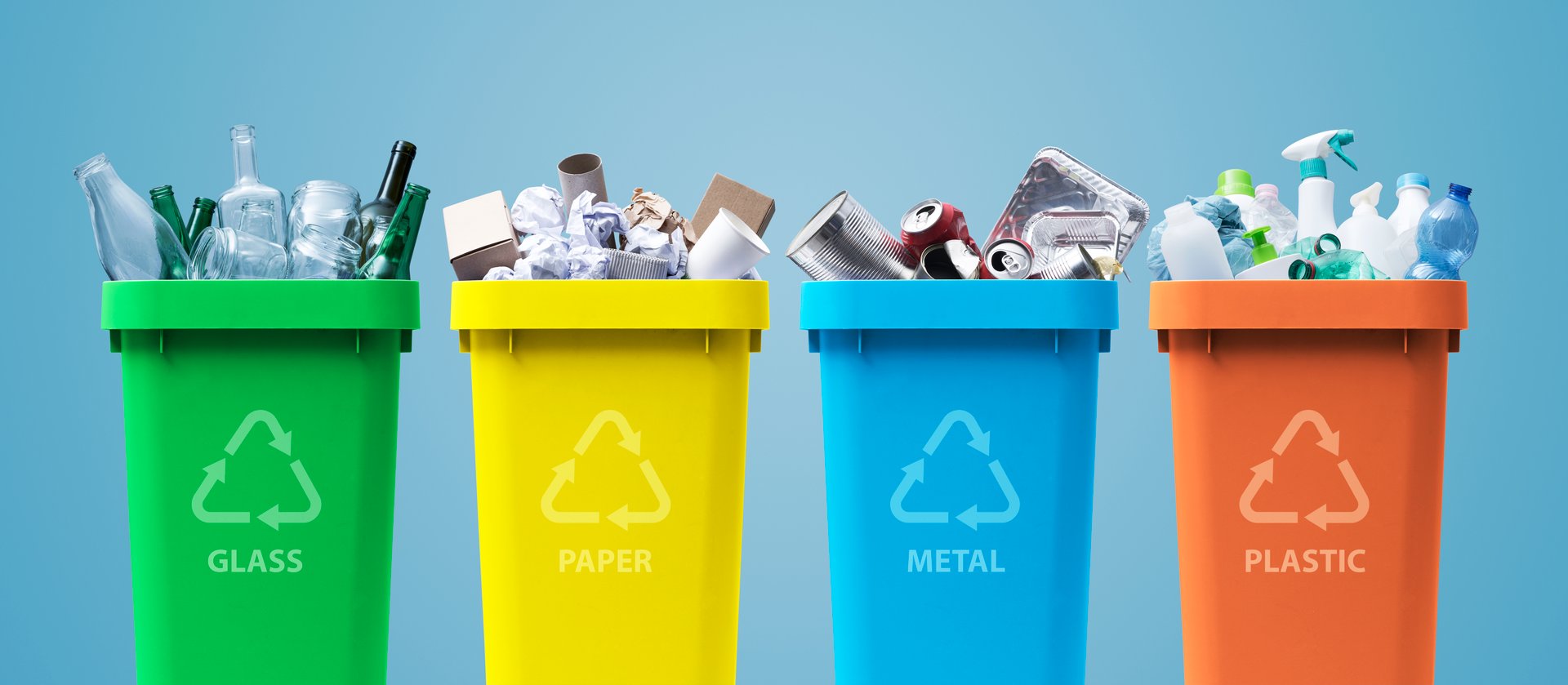 Collection of waste bins full of different types of garbage, recycling and separate waste collection concept