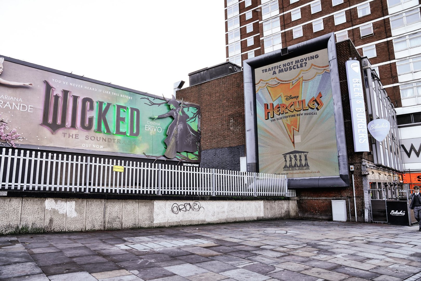 The street views of Uxbridge Road in the Shepherd's Bush district, a suburb of West London, Wicked movie advertisements and the Hercules musical performance at the Theatre Royal Drury Lane (in London's West End) in the London Borough of Hammersmith and Fulham, Greater London, England, United Kingdom.