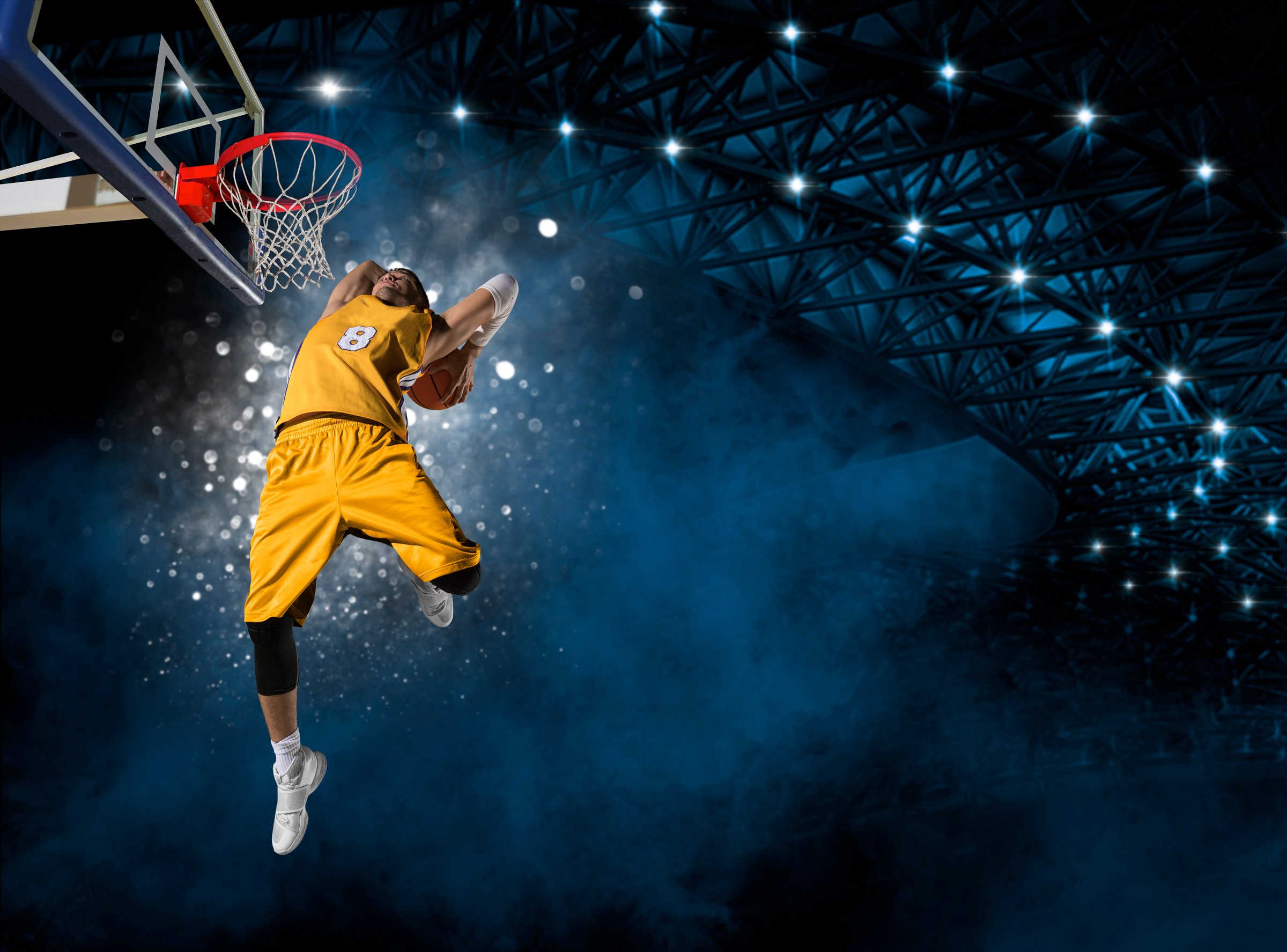 Basketball player players in action. Basketball concept on dark smoke background