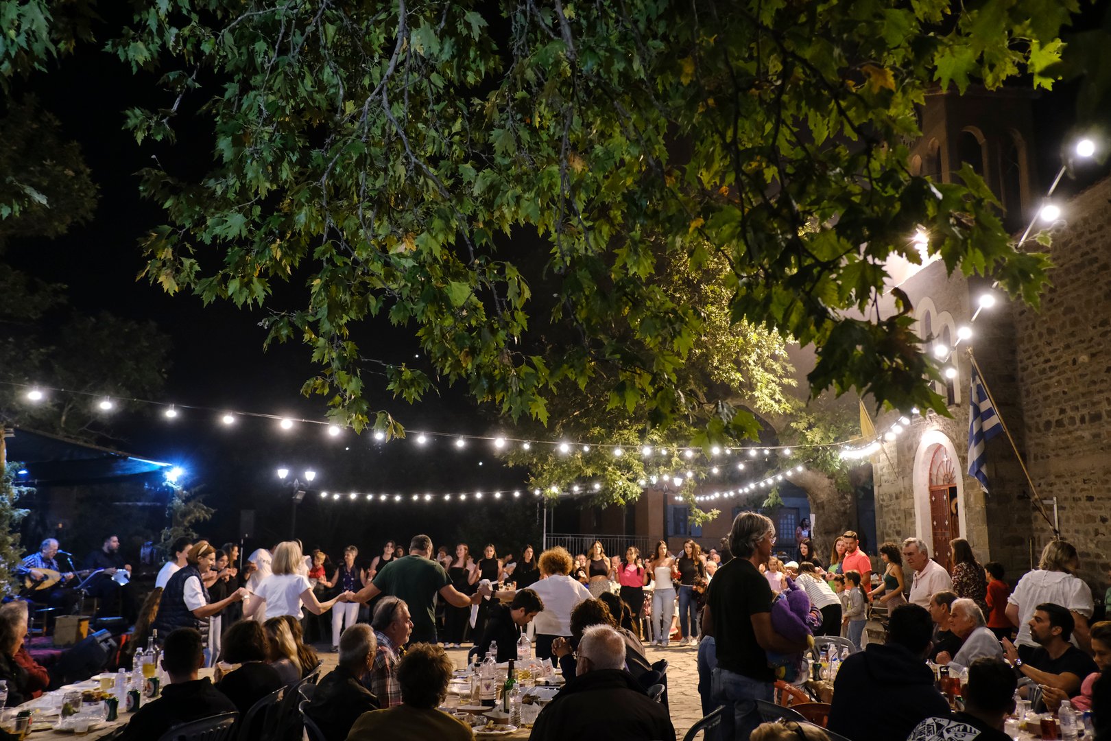 People take part in festivities as they dance traditional folks dances during a festival in Lefka or Paloukova village in Greece on July  27, 2024.