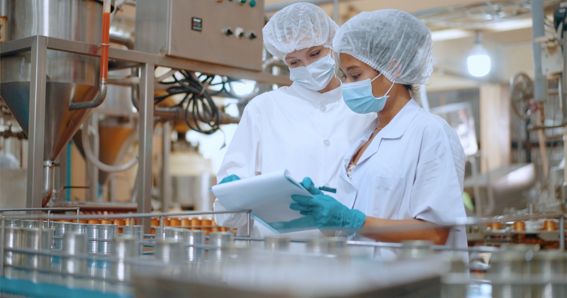 Canned food manufacturing factory industry. Quality control officer inspecting production line. Worker preparing sardines packaging into aluminum cans. Processed food production business entrepreneur.