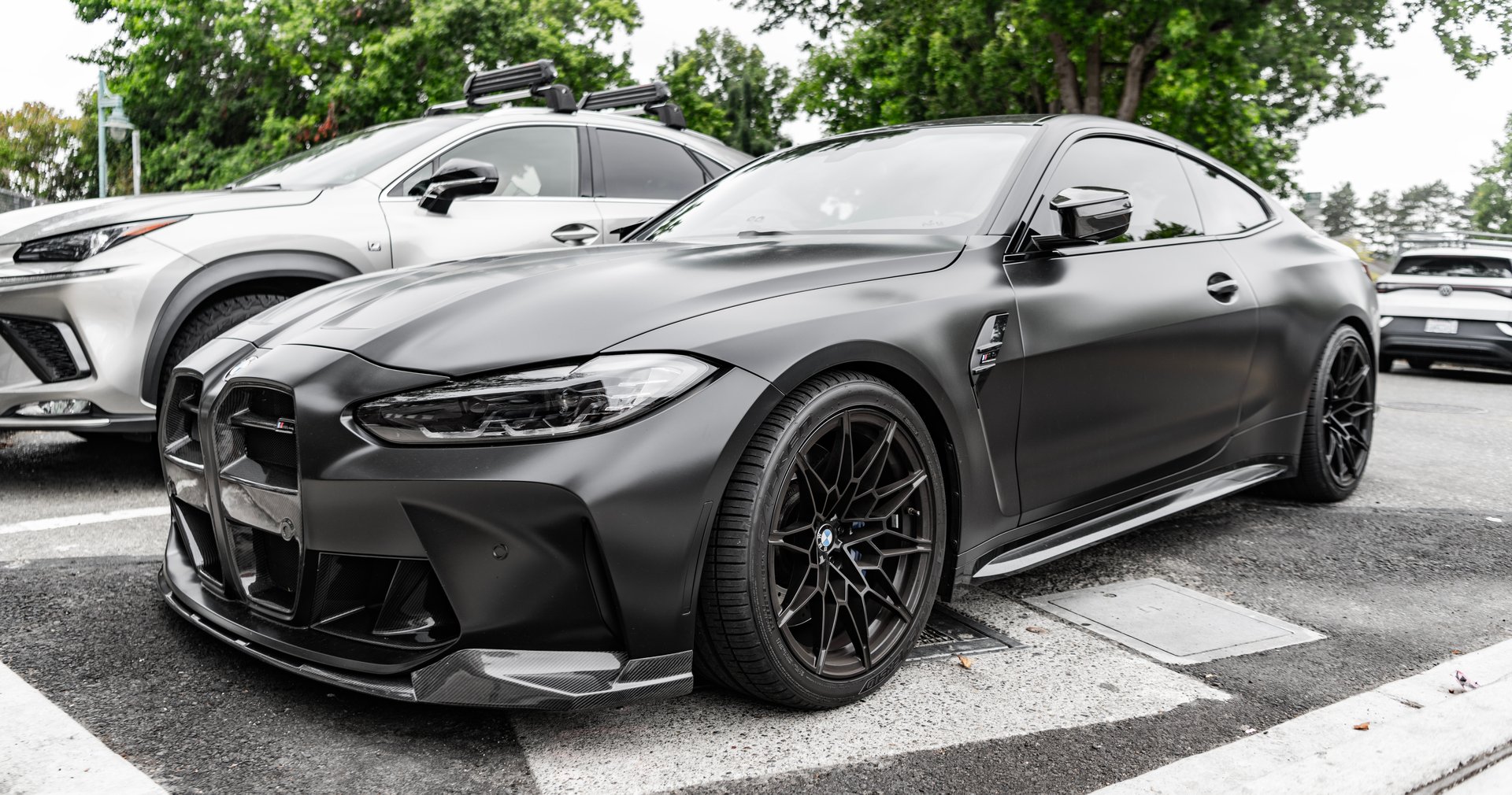 Seattle, WA, USA -July 22, 2024: Matte Black BMW M4 Competition. BMW, is a German multinational manufacturer of luxury vehicles and motorcycles. BMW is a prestige car