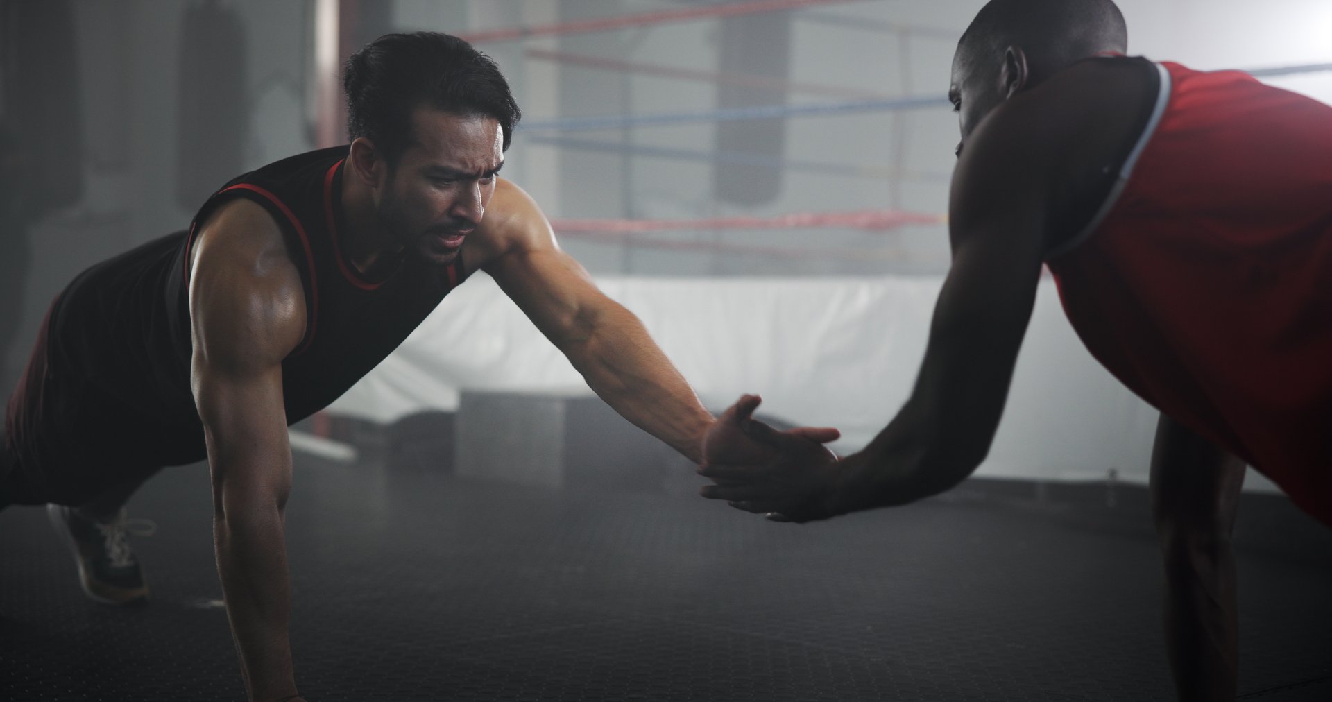 Fitness, people or pushup with high five at gym for boxing workout, strength training or endurance challenge. Sports, coach or boxer with exercise for for core stability, match preparation or support