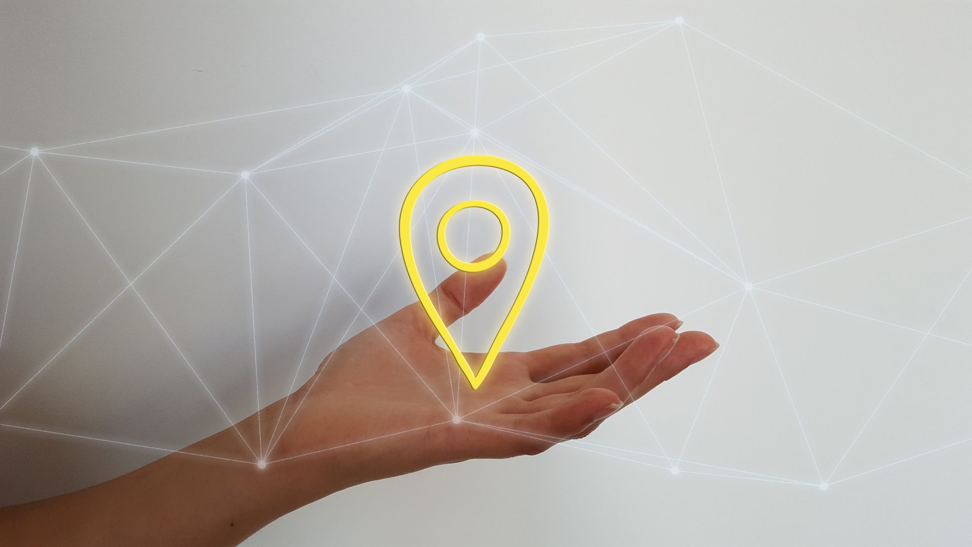 Woman hand on blurred background holding digital localisation map