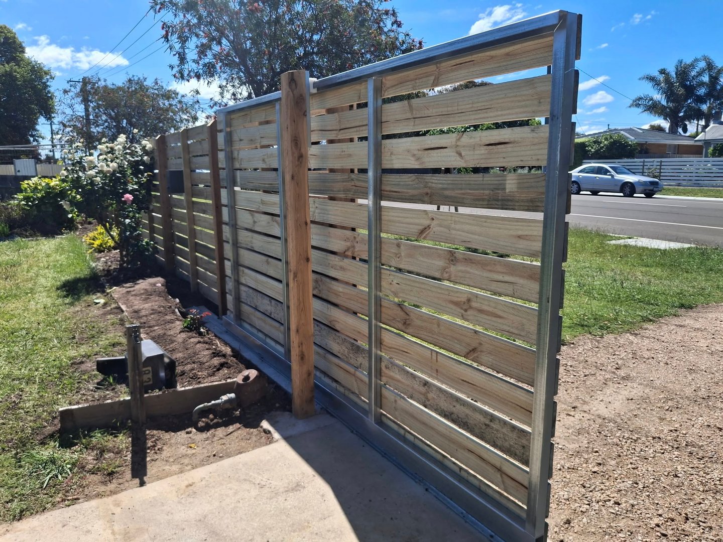 Wooden plank fence in backyard