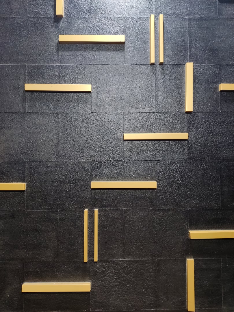 Abstract gold color lines on dark black wall design detail texture