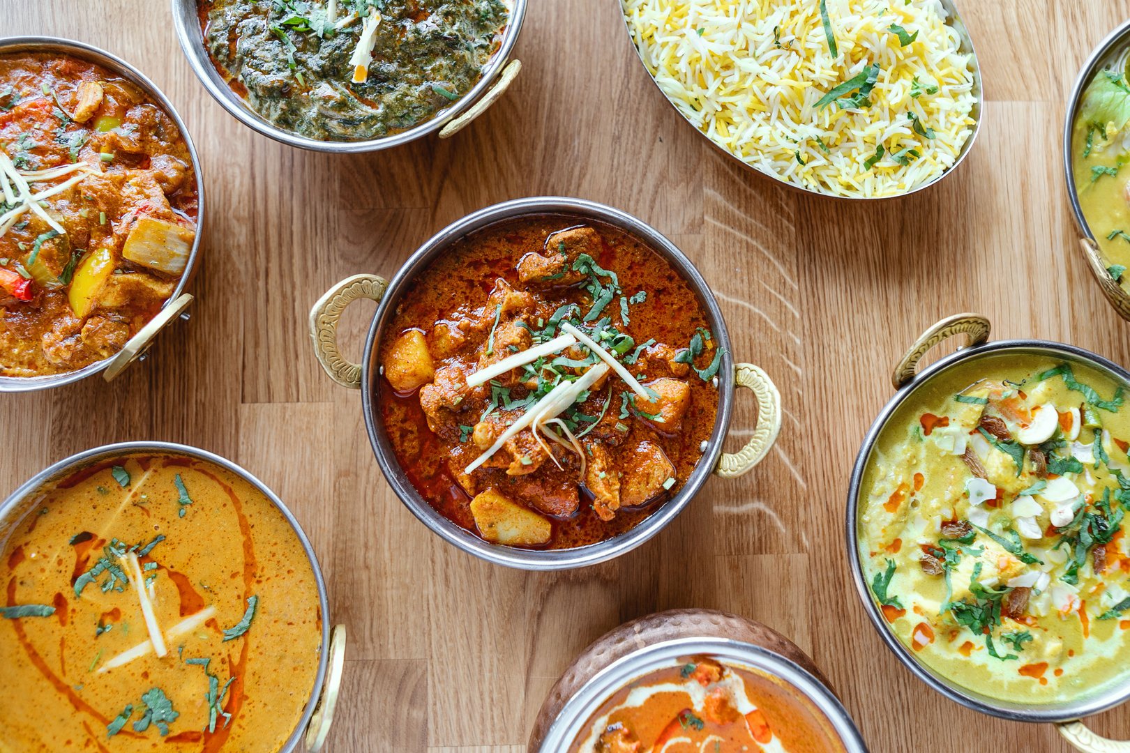 Composition of different indian street food on wooden background