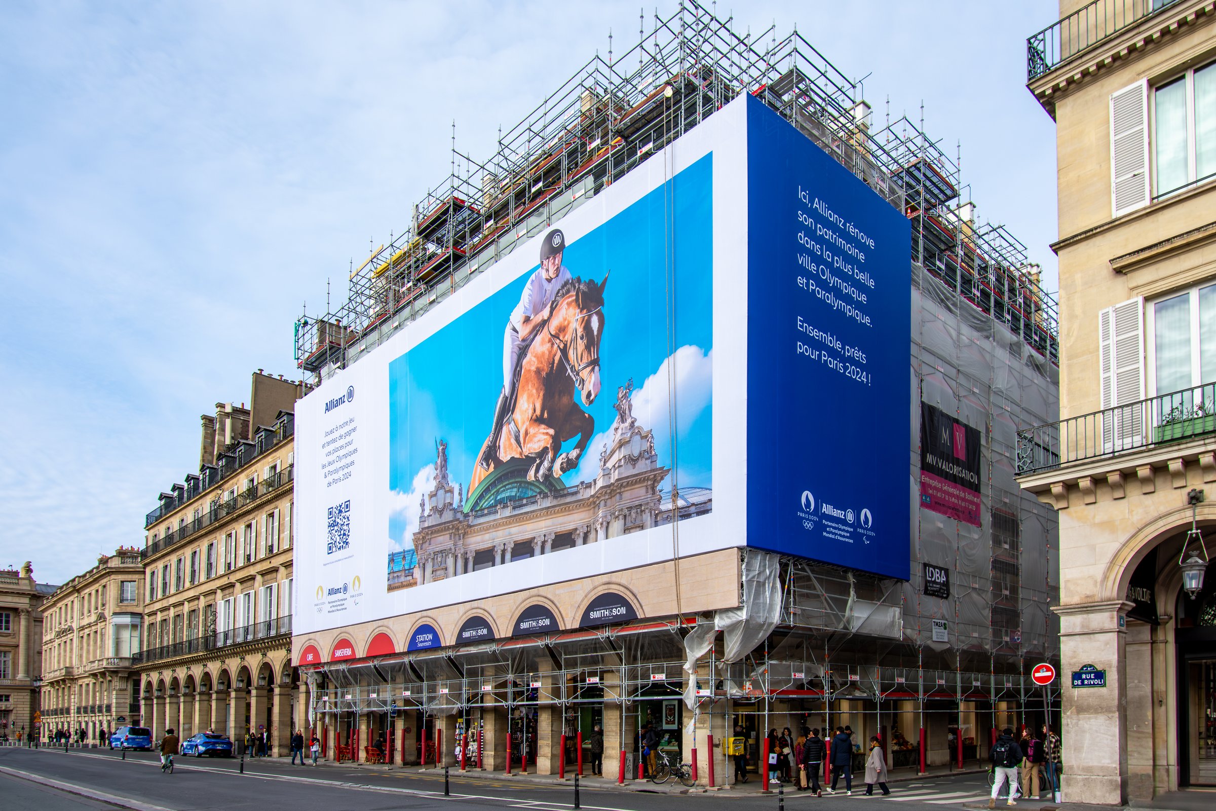 Giant advertising billboard on building scaffolding
