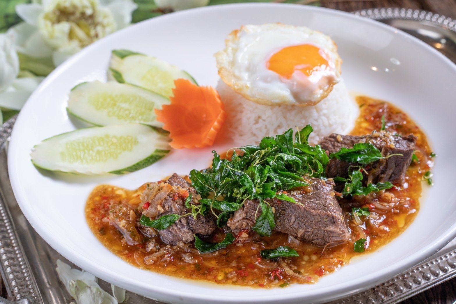 Pad Krapow Gai, Thai Basil Chicken with rice and fried egg.