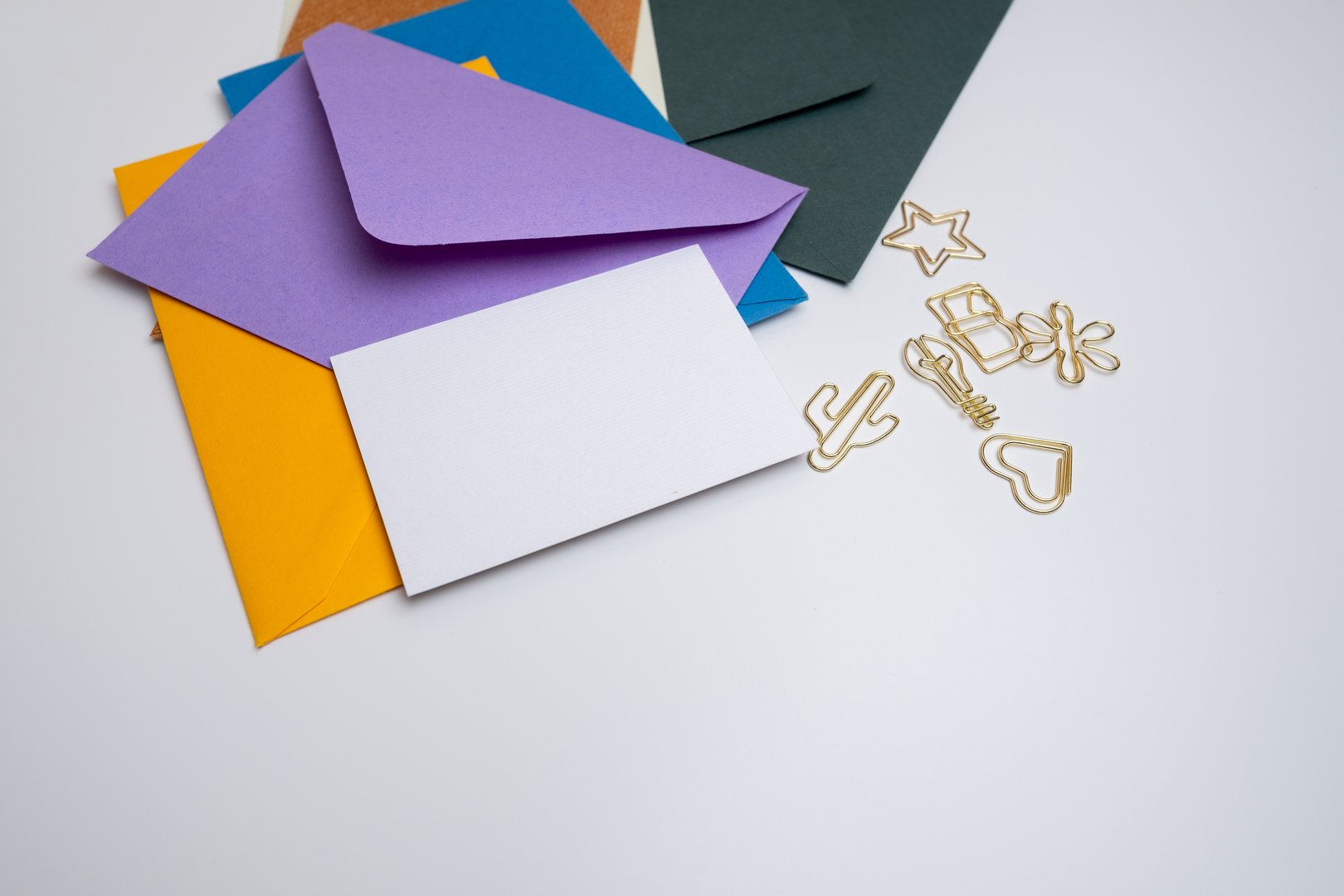 Paper envelopes on a light background. New mail, write a message. Send and receive mail. Postal delivery service. Empty envelope, empty space. Communication with people, paperwork. Envelope close-up
