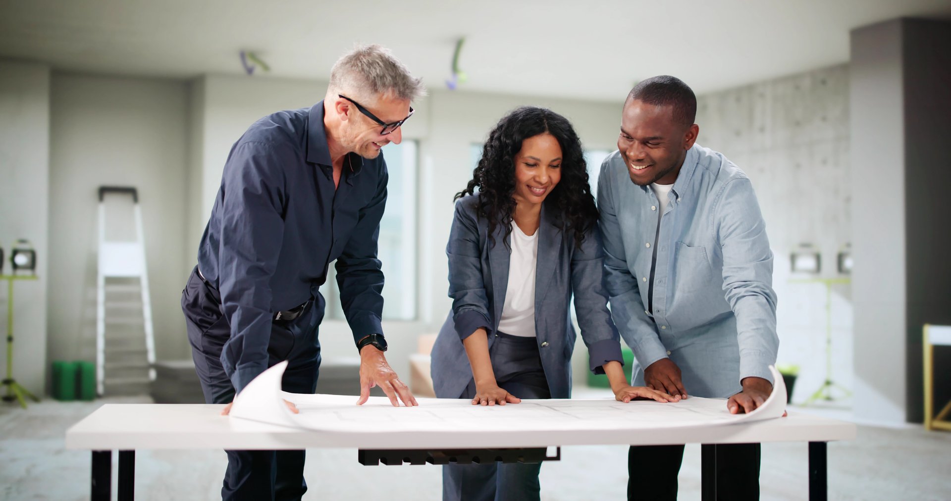 Diverse Family Discusses Renovation Plans With Real Estate Agent.