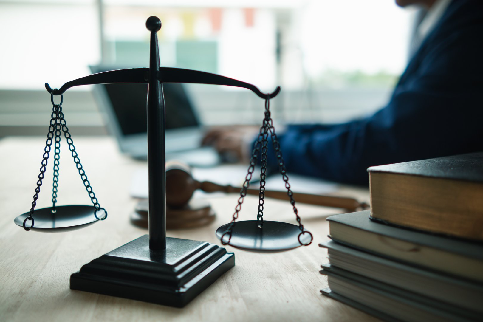 Brass scales are placed on lawyers desks in legal advice offices as a symbol of fairness and integrity in the High Court decision making